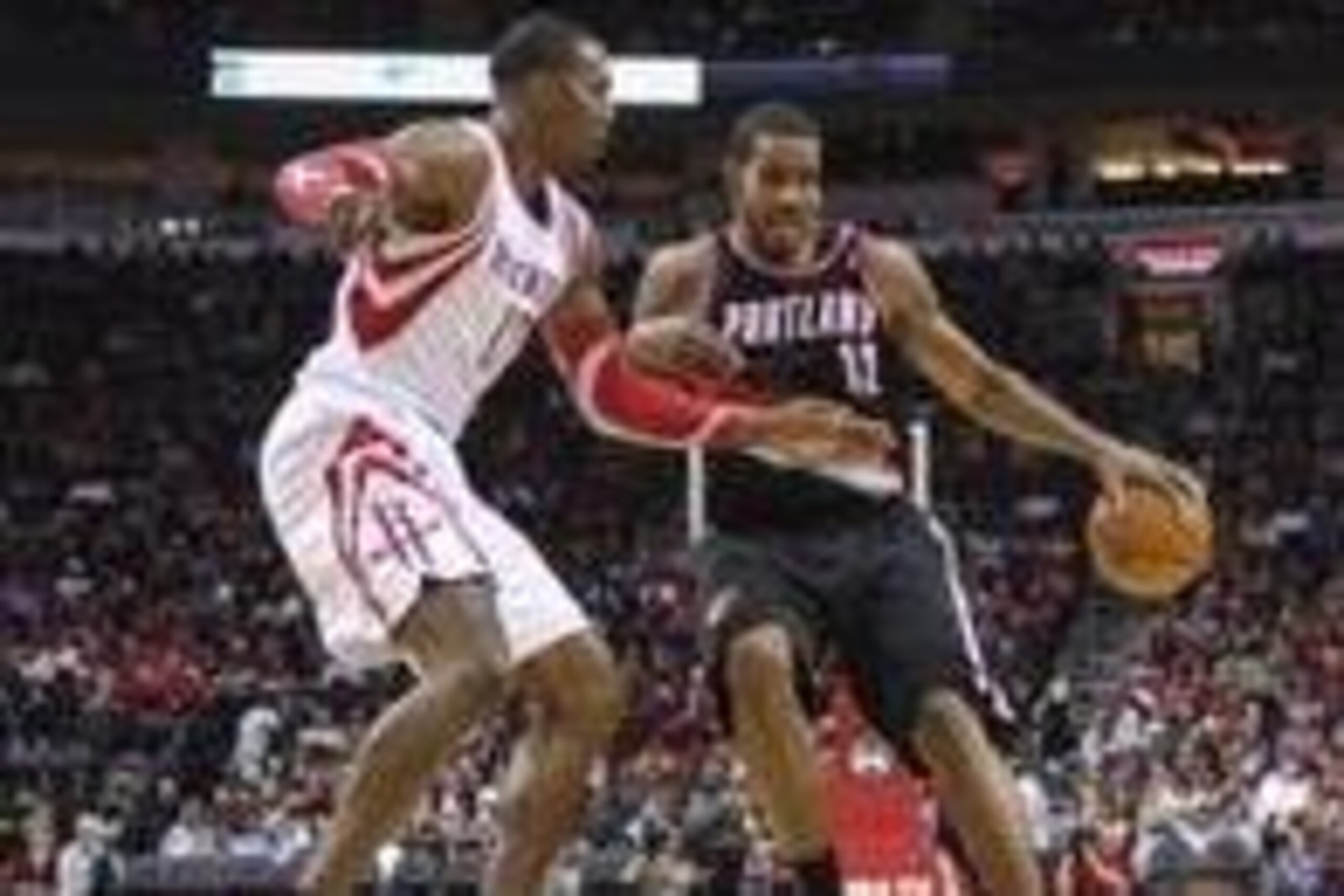 Jan 20, 2014; Houston, TX, USA; Portland Trail Blazers power forward LaMarcus Aldridge (12) controls the ball during the third quarter as Houston Rockets center Dwight Howard (12) defends at Toyota Center. The Rockets defeated the Trailblazers 126-113. Ma