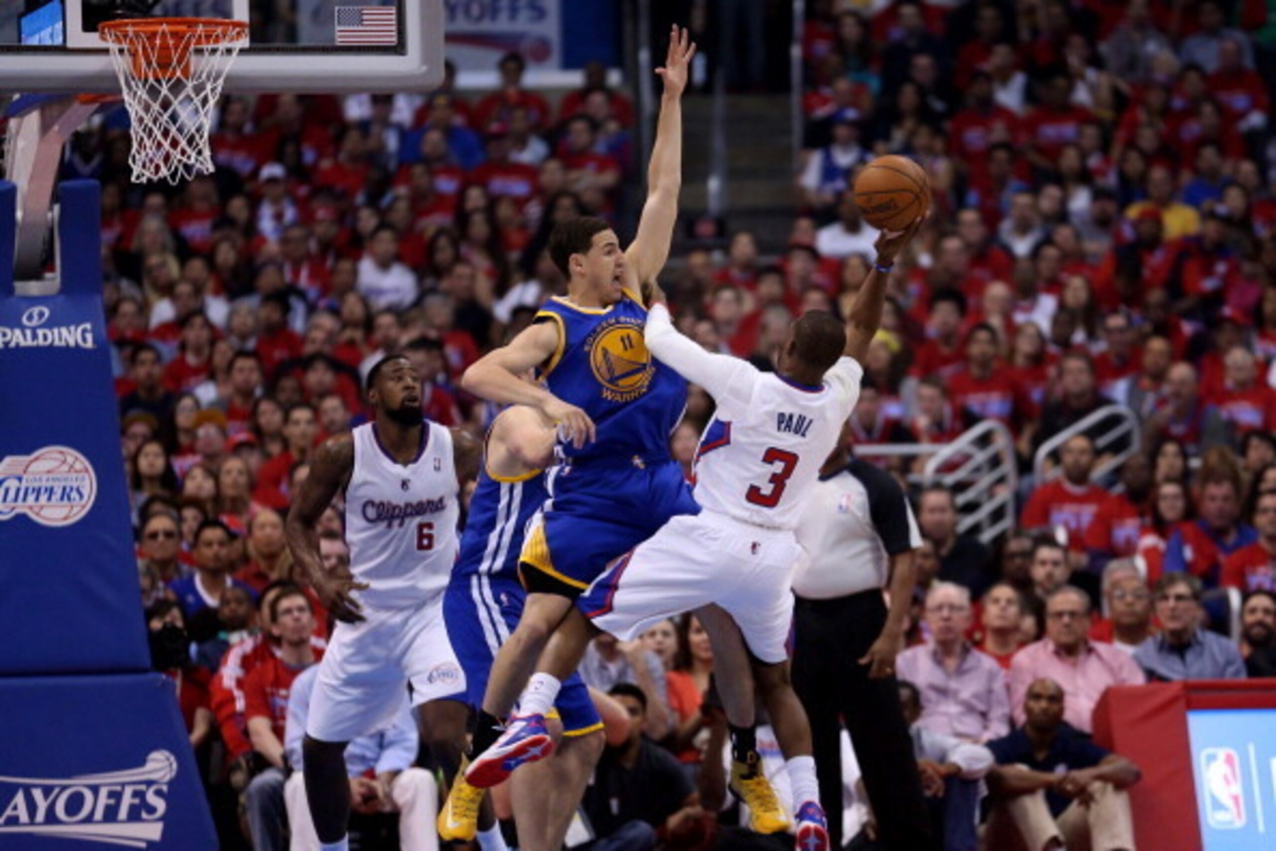 LOS ANGELES, CA - APRIL 19: Chris Paul #3 of the Los Angeles Clippers tries to shoot over Klay Thompson #11 of the Golden State Warriors in Game One of the Western Conference Quarterfinals during the 2014 NBA Playoffs at Staples Center on April 19, 2014 i