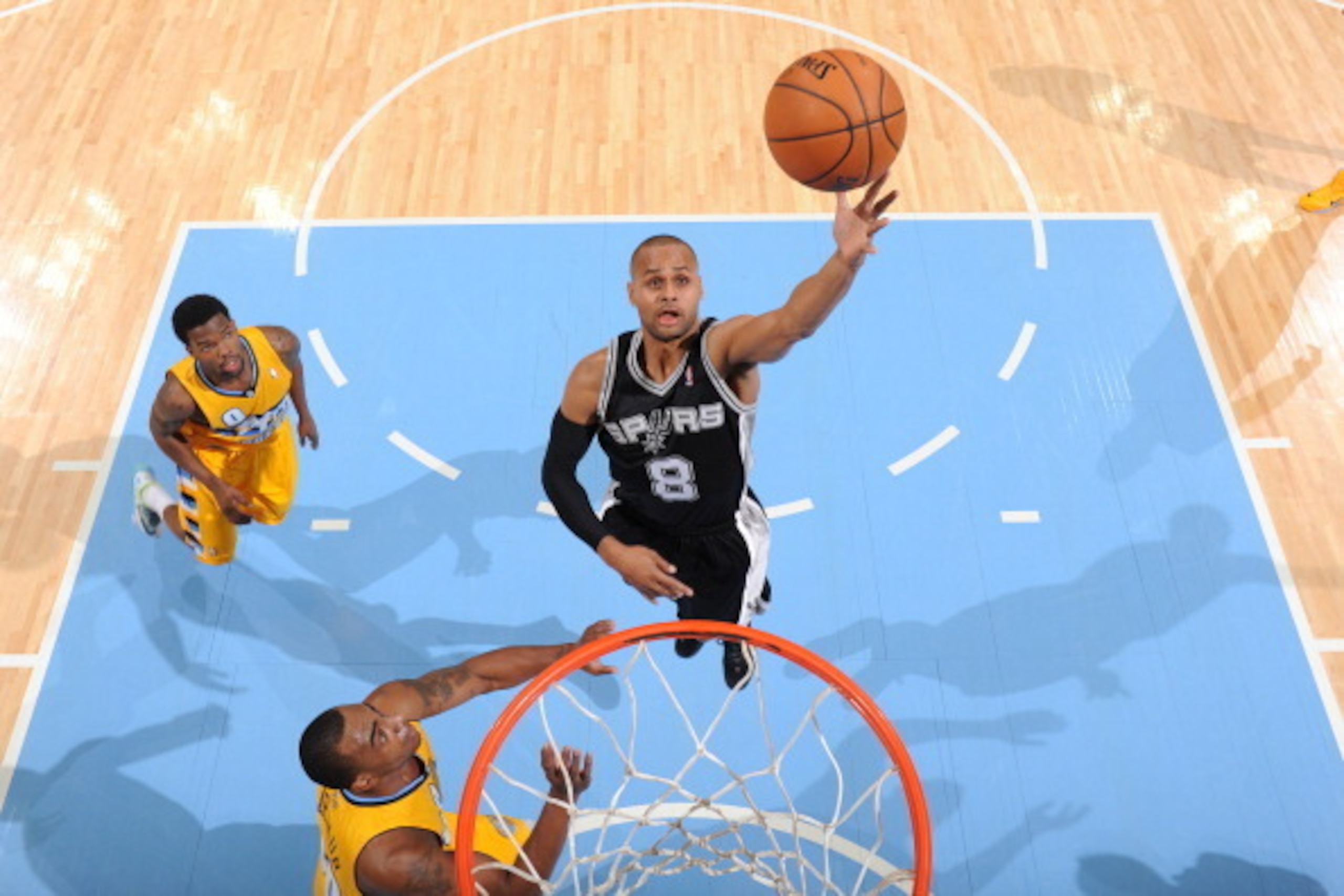 DENVER, CO - MARCH 28: Patty Mills #8 of the San Antonio Spurs takes a shot against the Denver Nuggets on March 28, 2014 at the Pepsi Center in Denver, Colorado. NOTE TO USER: User expressly acknowledges and agrees that, by downloading and/or using this P