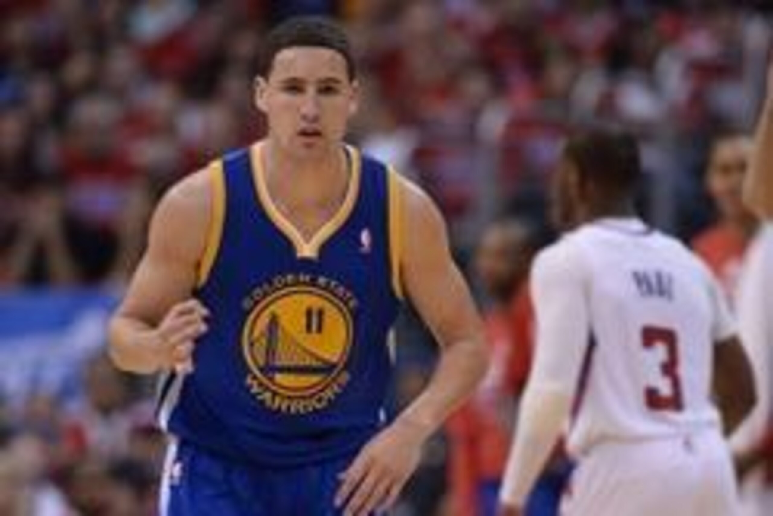Apr 19, 2014; Los Angeles, CA, USA; Golden State Warriors guard Klay Thompson (11) heads down court after a 3-point basket in the second half of game one of the first round of the 2014 NBA Playoffs at Staples Center. Warriors won 109-105. Mandatory Credit