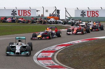 SHANGHAI, CHINA - APRIL 20:  Lewis Hamilton of Great Britain and Mercedes GP leads Sebastian Vettel of Germany and Infiniti Red Bull Racing and Fernando Alonso of Spain and Ferrari into the third corner during the Chinese Formula One Grand Prix at the Sha