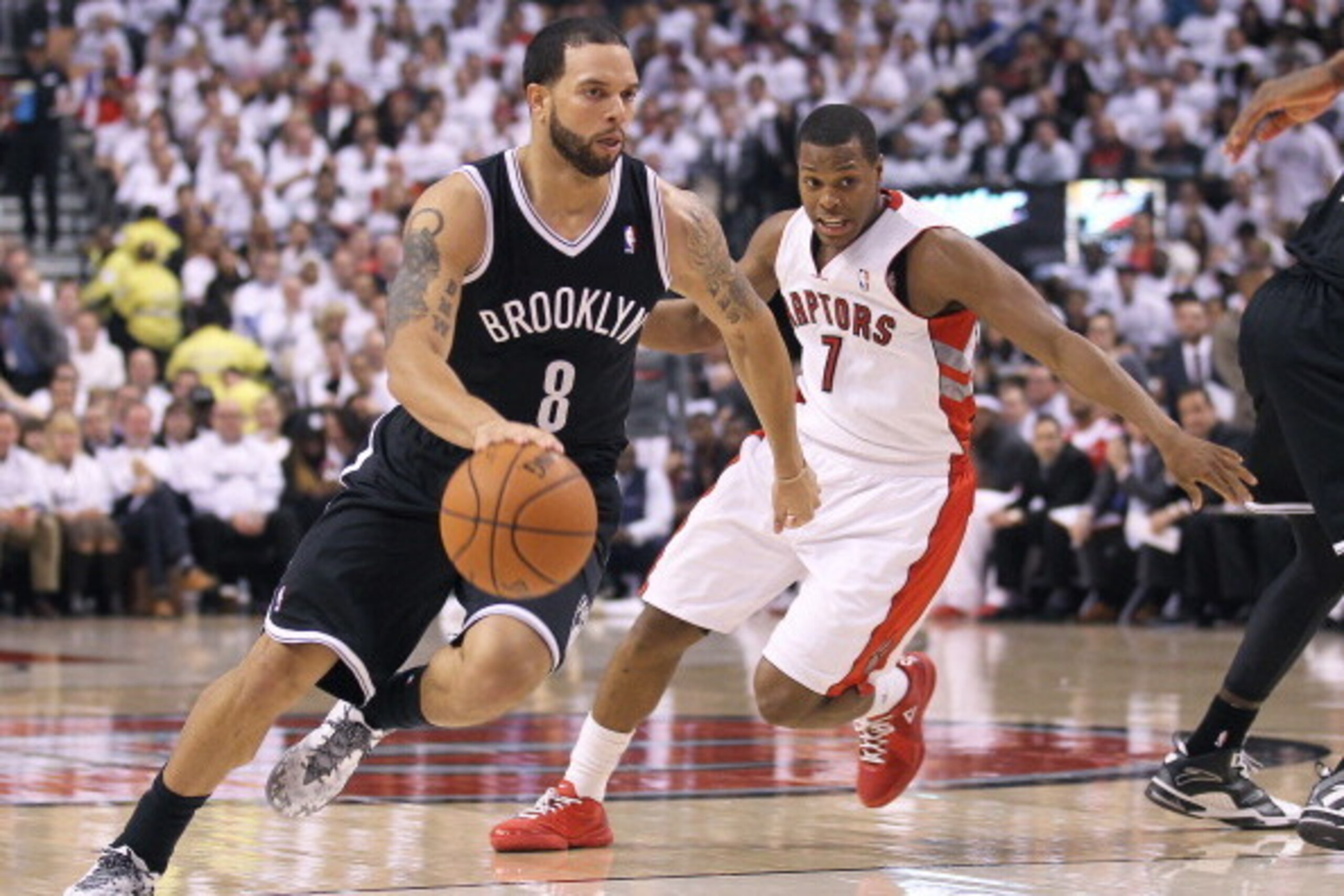 TORONTO, ON - APRIL 22:  Deron Williams #8 of the Brooklyn Nets plays against Kyle Lowry #7 of the Toronto Raptors in Game Two of the NBA Eastern Conference Play-off at the Air Canada Centre on April 22, 2014 in Toronto, Ontario, Canada. The Raptors defea
