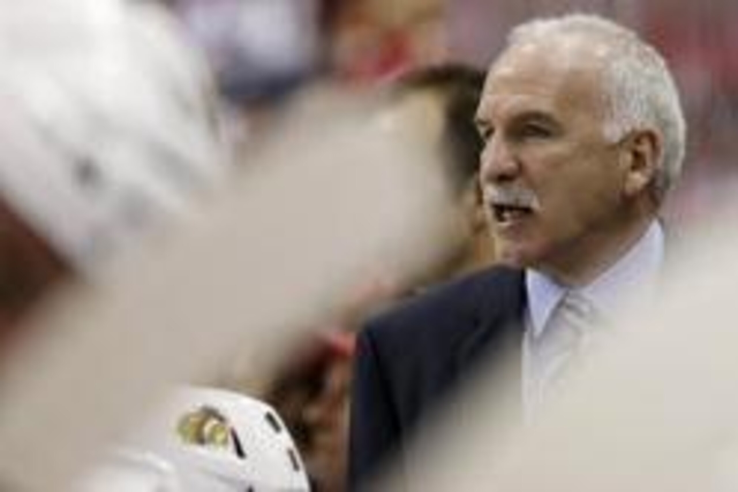 Apr 11, 2014; Washington, DC, USA; Chicago Blackhawks head coach Joel Quenneville watches from behind the bench against the Washington Capitals in the second period at Verizon Center. The Capitals won 4-0. Mandatory Credit: Geoff Burke-USA TODAY Sports