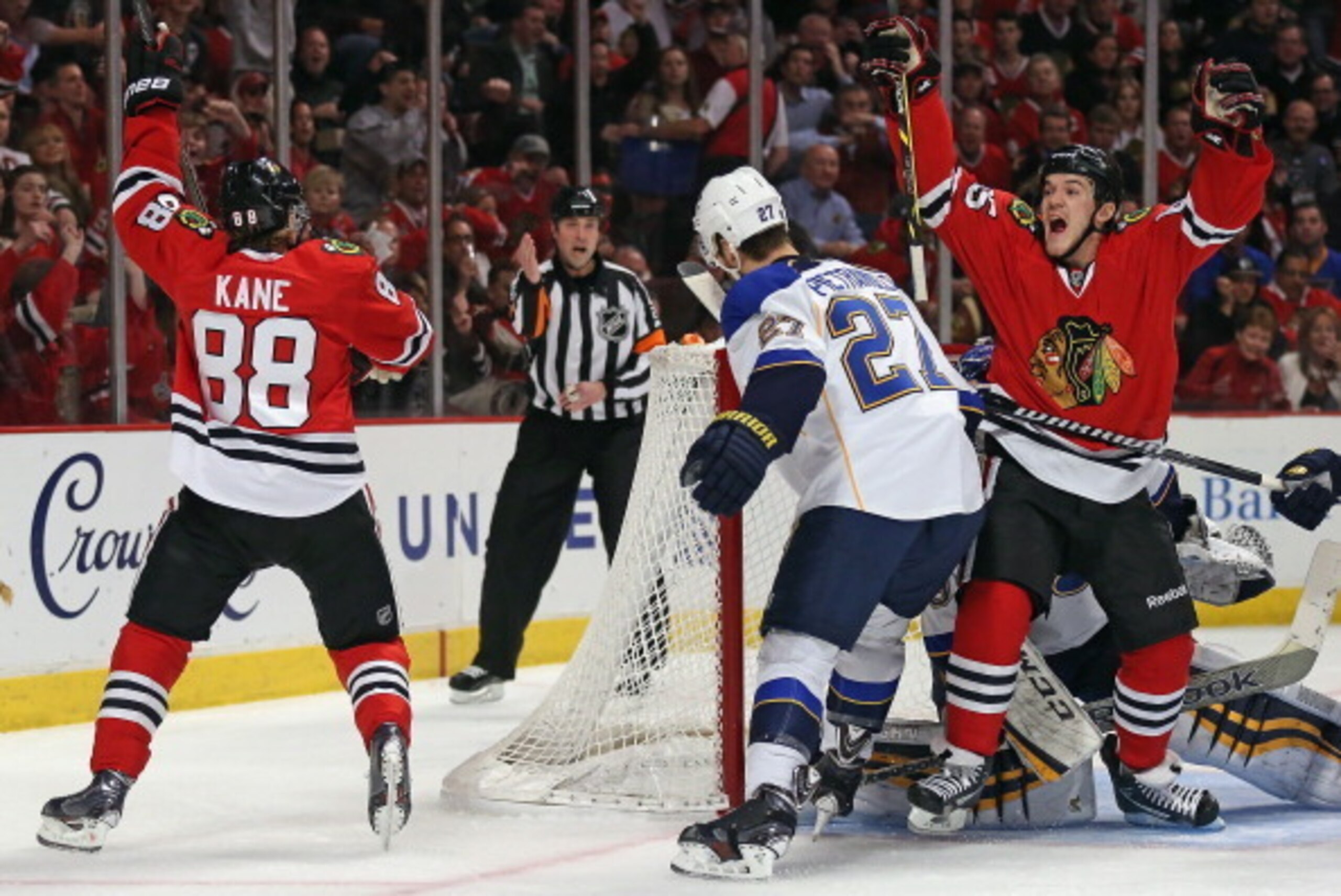 CHICAGO, IL - APRIL 23: Andrew Shaw #65 and Patrick Kane #88 of the Chicago Blackhawks celebrate a second period goal by Shaw against Alex Pietrangelo #27 and the St. Louis Blues in Game Four of the First Round of the 2014 NHL Stanley Cup Playoffs at the 