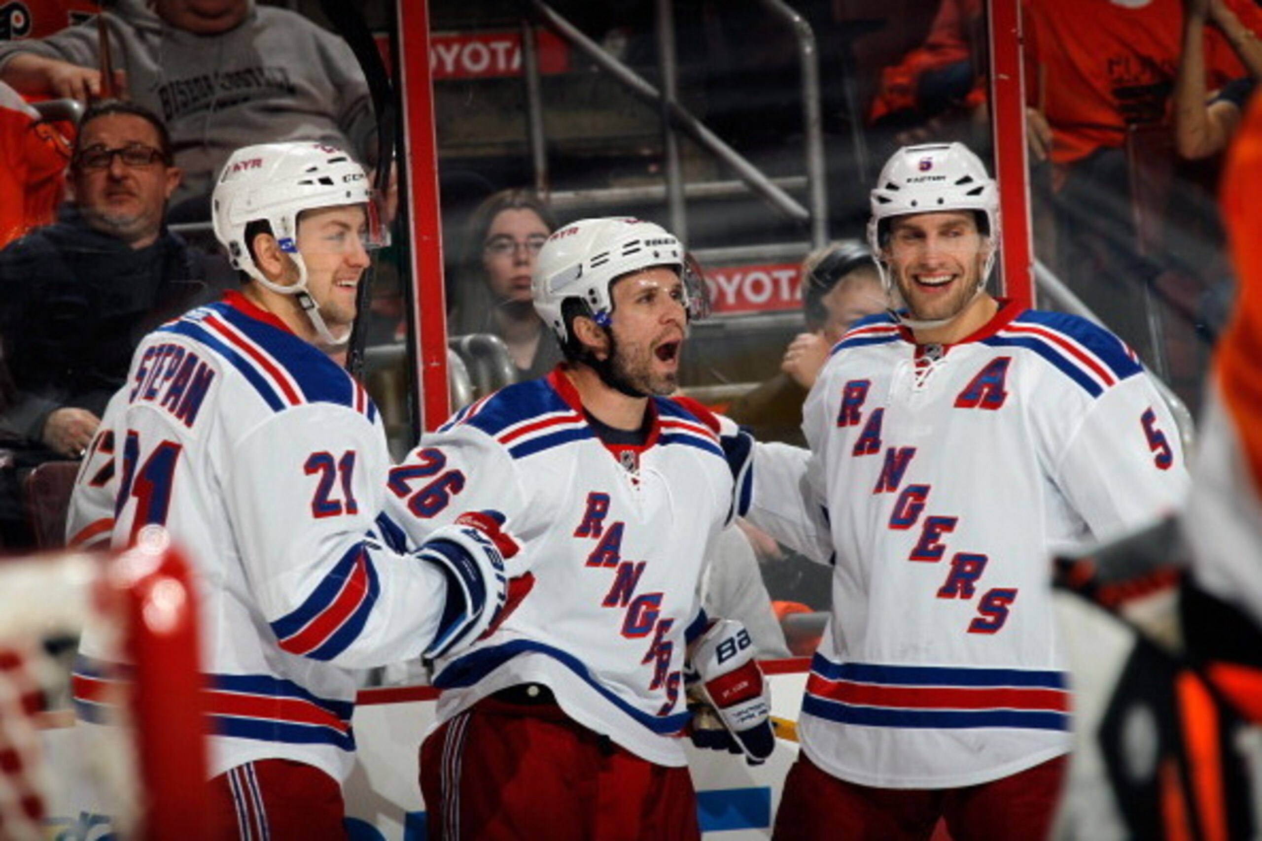 PHILADELPHIA, PA - APRIL 22:  Martin St. Louis #26 of the New York Rangers (C) celebrates his goal at 10:24 of the first period along with Derek Stepan #21 (L) and Dan Girardi #5 (R) against the Philadelphia Flyers in Game Three of the First Round of the 