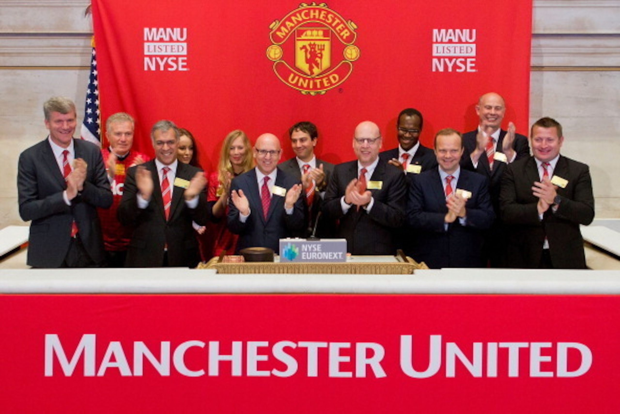 NEW YORK, NY - AUGUST 10:  In this handout photo provided by the NYSE Euronext, Manchester United Executives David Gill (L), Joel Glazer (3rd L) and Avram Glazer (4th L) and Ed Woodward prepare to ring the Opening Bell at the New York Stock Exchange on Au