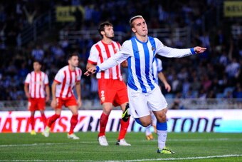 SAN SEBASTIAN, SPAIN - OCTOBER 27:  Antoine Griezmann of Real Sociedad de Futbol celebrates after scoring his team's second goal during the La Liga match between Real Sociedad de Futbol and UD Almeria at Estadio Anoeta on October 27, 2013 in San Sebastian