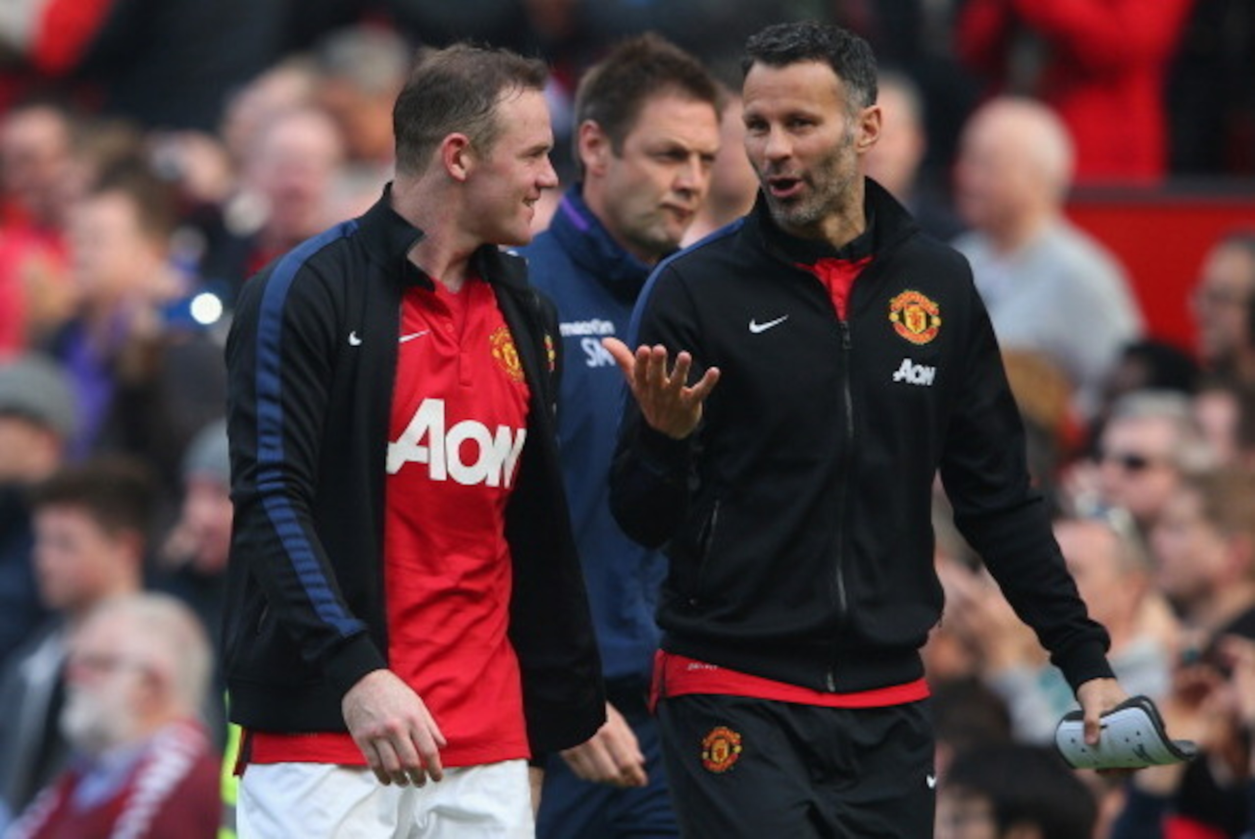MANCHESTER, ENGLAND - MARCH 29:  Wayne Rooney of Manchester United walks off with Ryan Giggs (R) at the end of the Barclays Premier League match between Manchester United and Aston Villa at Old Trafford on March 29, 2014 in Manchester, England.  (Photo by
