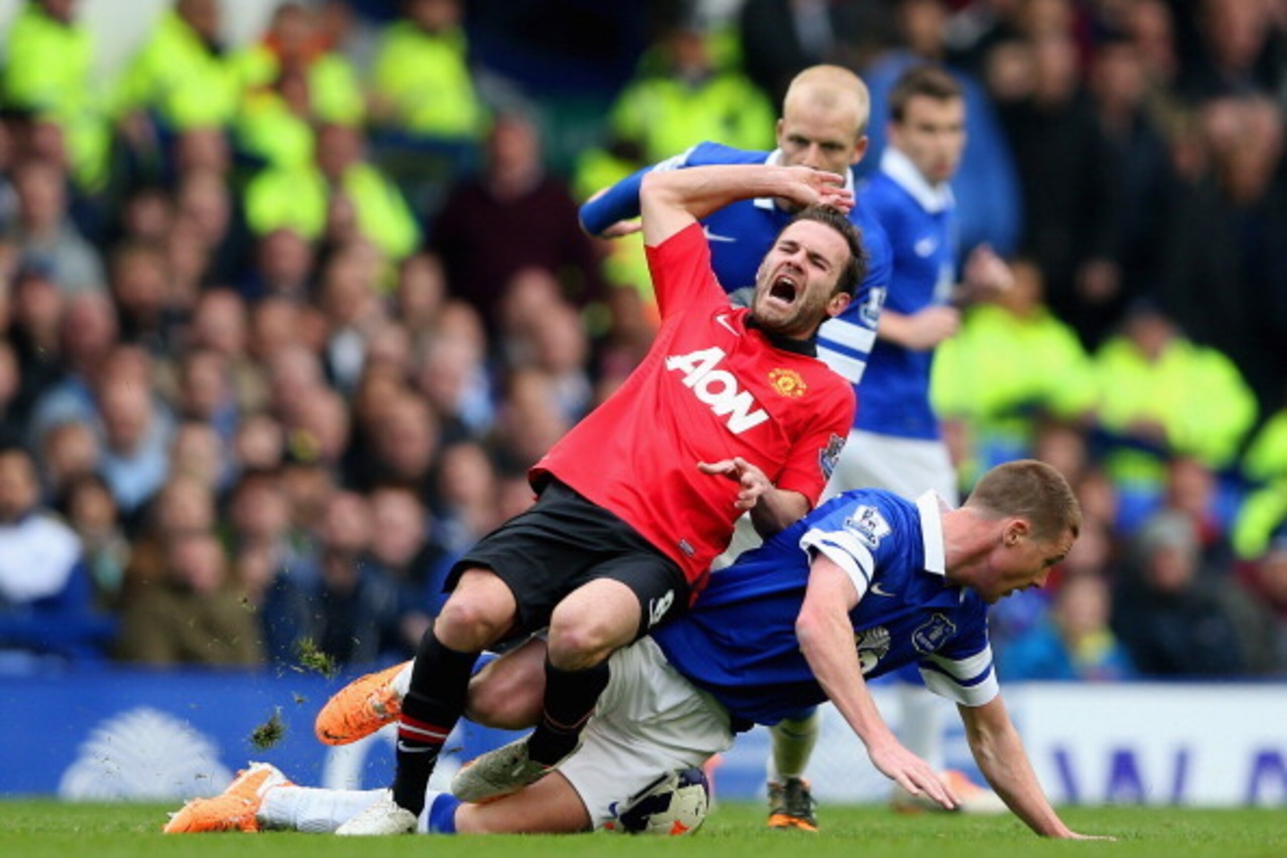 LIVERPOOL, ENGLAND - APRIL 20:  Juan Mata of Manchester United is tackled by James McCarthy of Everton during the Barclays Premier League match between Everton and Manchester United at Goodison Park on April 20, 2014 in Liverpool, England.  (Photo by Cliv