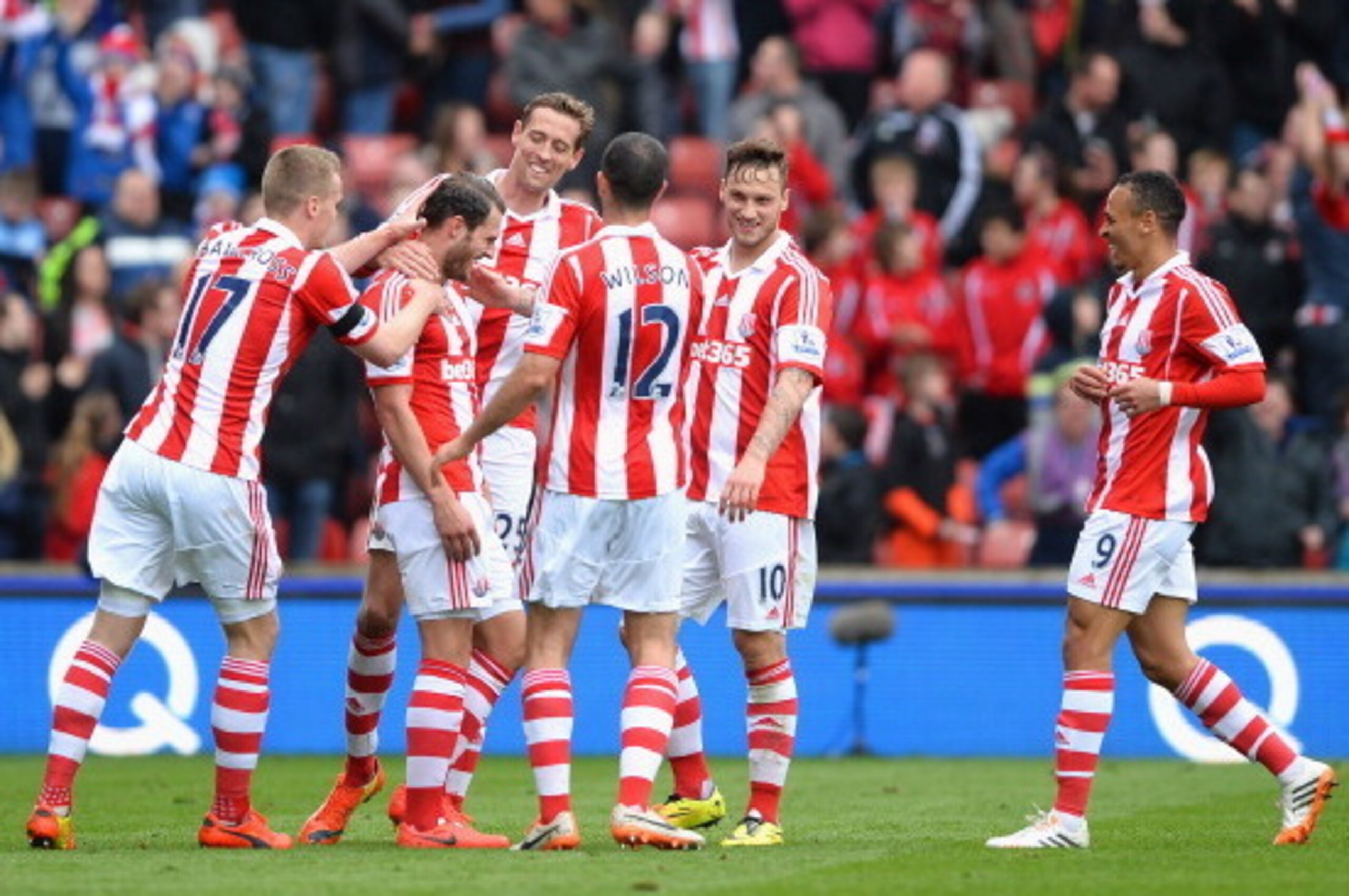 STOKE ON TRENT, ENGLAND - APRIL 12: Erik Pieters of Stoke City is mobbed after scoring a first half goal during the Barclays Premier League match between Stoke City and Newcastle United at Britannia Stadium on April 12, 2014 in Stoke on Trent, England. ( STOKE ON TRENT, ENGLAND - APRIL 12: Erik Pieters of Stoke City is mobbed after scoring a first half goal during the Barclays Premier League match between Stoke City and Newcastle United at Britannia Stadium on April 12, 2014 in Stoke on Trent, England. (