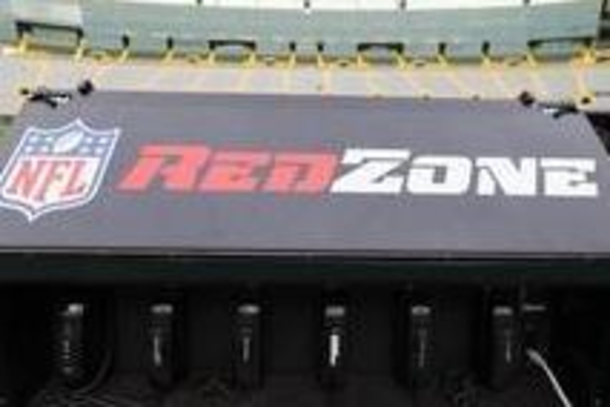 Sep 13, 2012; Green Bay, WI, USA;  NFL Red Zone logo telephones on the Green Bay Packers sidelines prior to the game against the Chicago Bears at Lambeau Field.  The Packers defeated the Bears 23-10.  Mandatory Credit: Jeff Hanisch-USA TODAY Sports