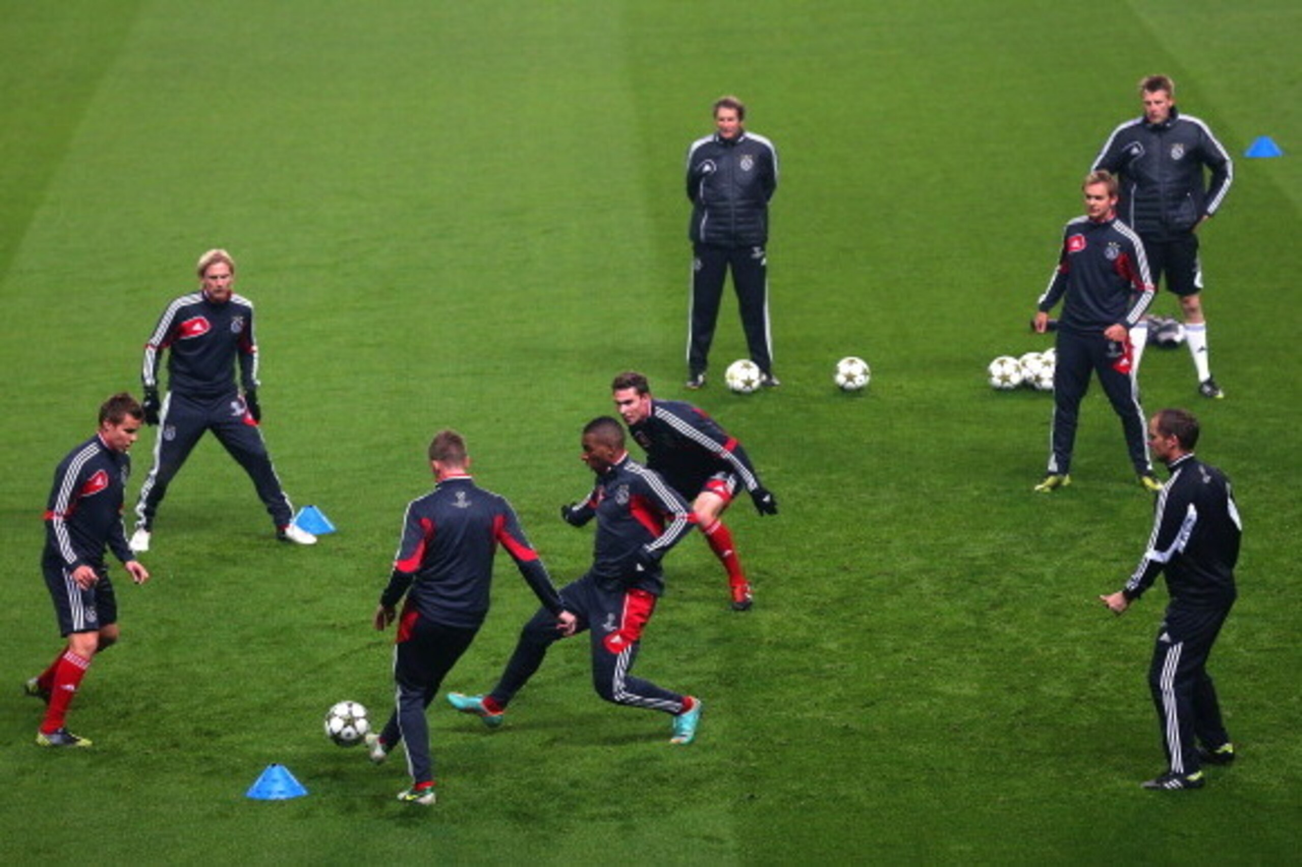 MANCHESTER, ENGLAND - NOVEMBER 05:  Ryan Babel of Ajax Amsterdam closes down Niklas Moisander during a training session at Etihad Stadium on November 5, 2012 in Manchester, England.  (Photo by Alex Livesey/Getty Images)