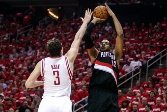 Apr 23, 2014; Houston, TX, USA; Portland Trail Blazers forward LaMarcus Aldridge (12) shoots during the second quarter as Houston Rockets center Omer Asik (3) defends in game two during the first round of the 2014 NBA Playoffs at Toyota Center. Mandatory