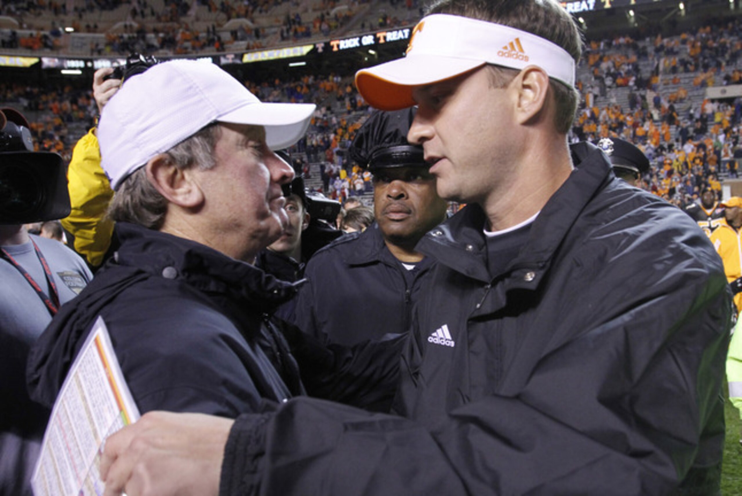 Spurrier and Kiffin share an embrace.