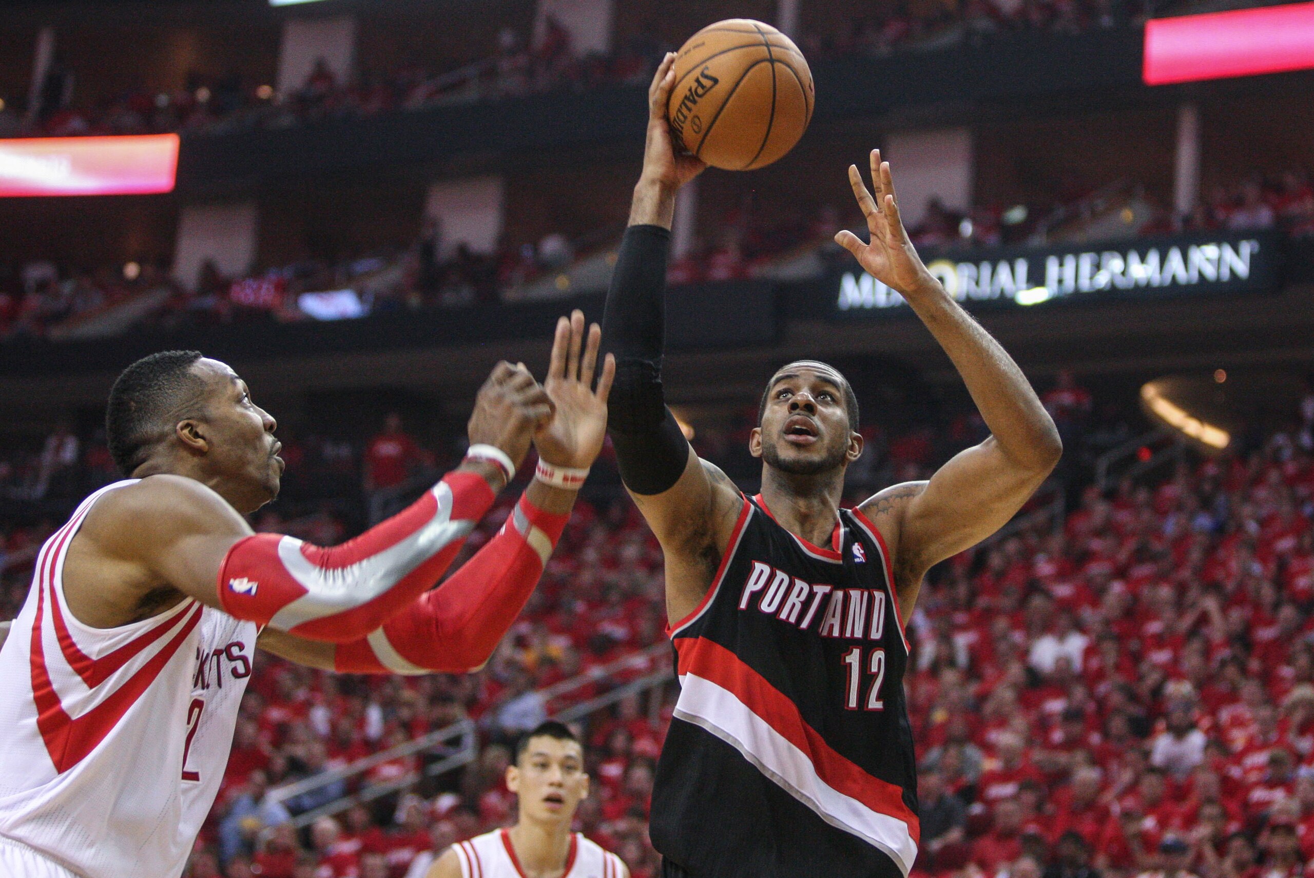 Apr 20, 2014; Houston, TX, USA; Portland Trail Blazers forward LaMarcus Aldridge (12) shoots the ball as Houston Rockets center Dwight Howard (12) defends during the second quarter in game one during the first round of the 2014 NBA Playoffs at Toyota Cent