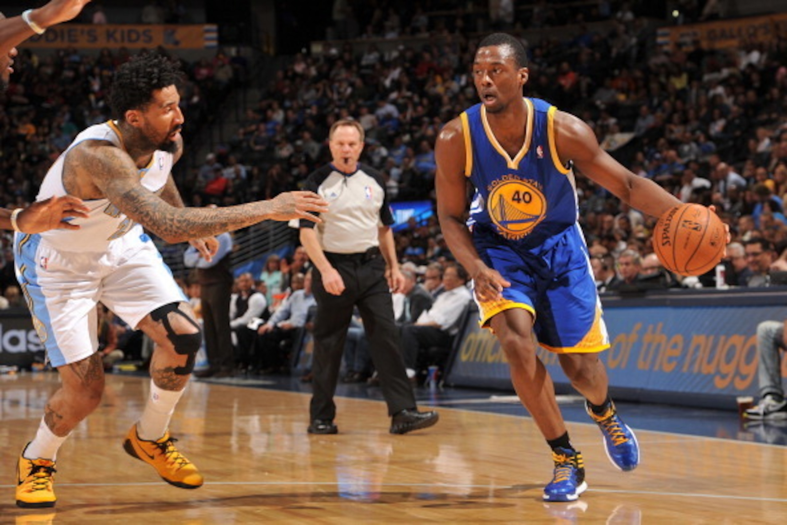 DENVER, CO - April 12: Harrison Barnes #40 of the Golden State Warriors drives against the Denver Nuggets on April 12, 2014 at the Pepsi Center in Denver, Colorado. NOTE TO USER: User expressly acknowledges and agrees that, by downloading and/or using thi