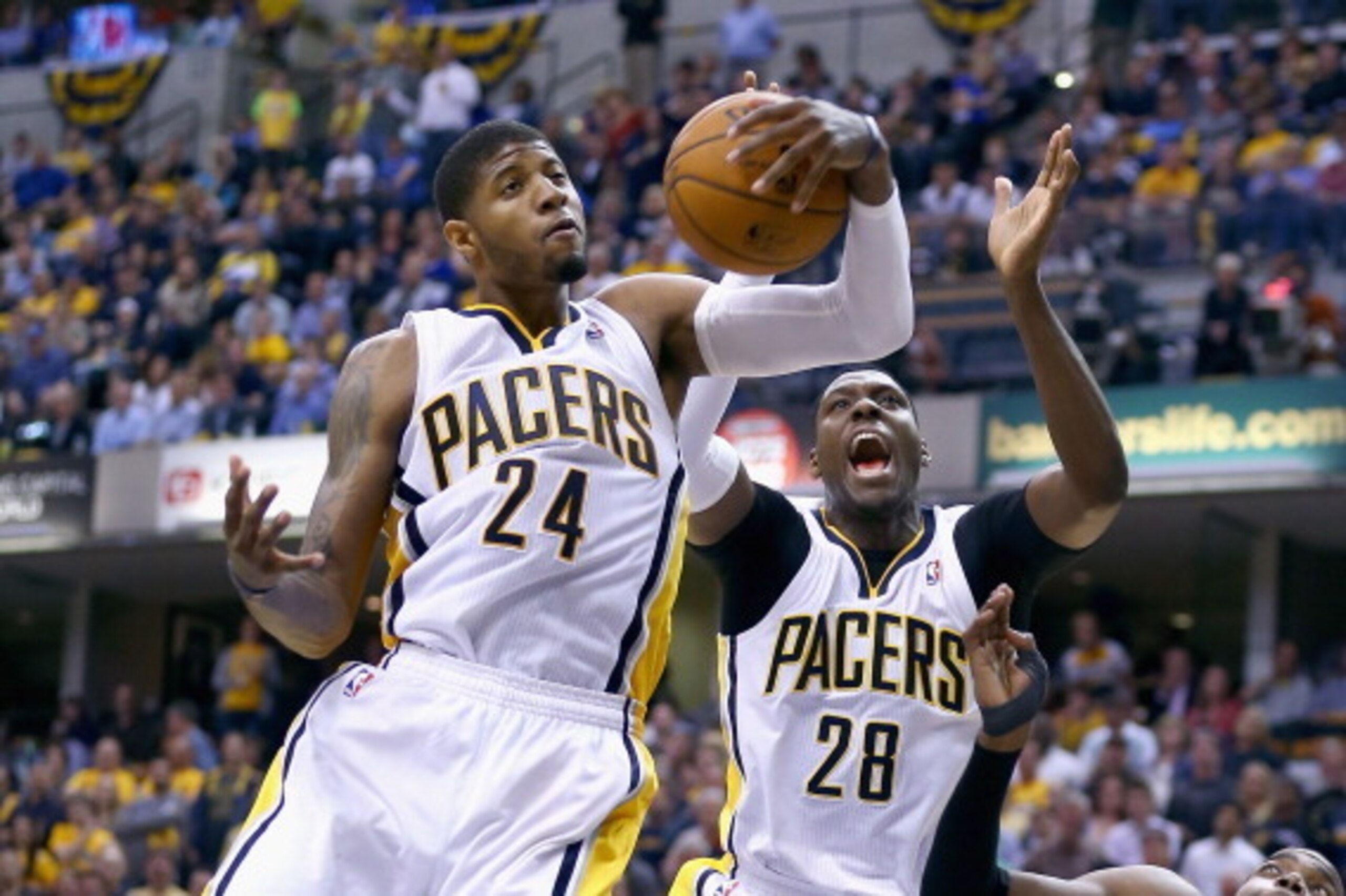 INDIANAPOLIS, IN - APRIL 22:  Paul George #4 of the Indiana Pacers grabs a rebound against the Atlanta Hawks in Game 2 of the Eastern Conference Quarterfinals during the 2014 NBA Playoffs at Bankers Life Fieldhouse on April 22, 2014 in Indianapolis, India