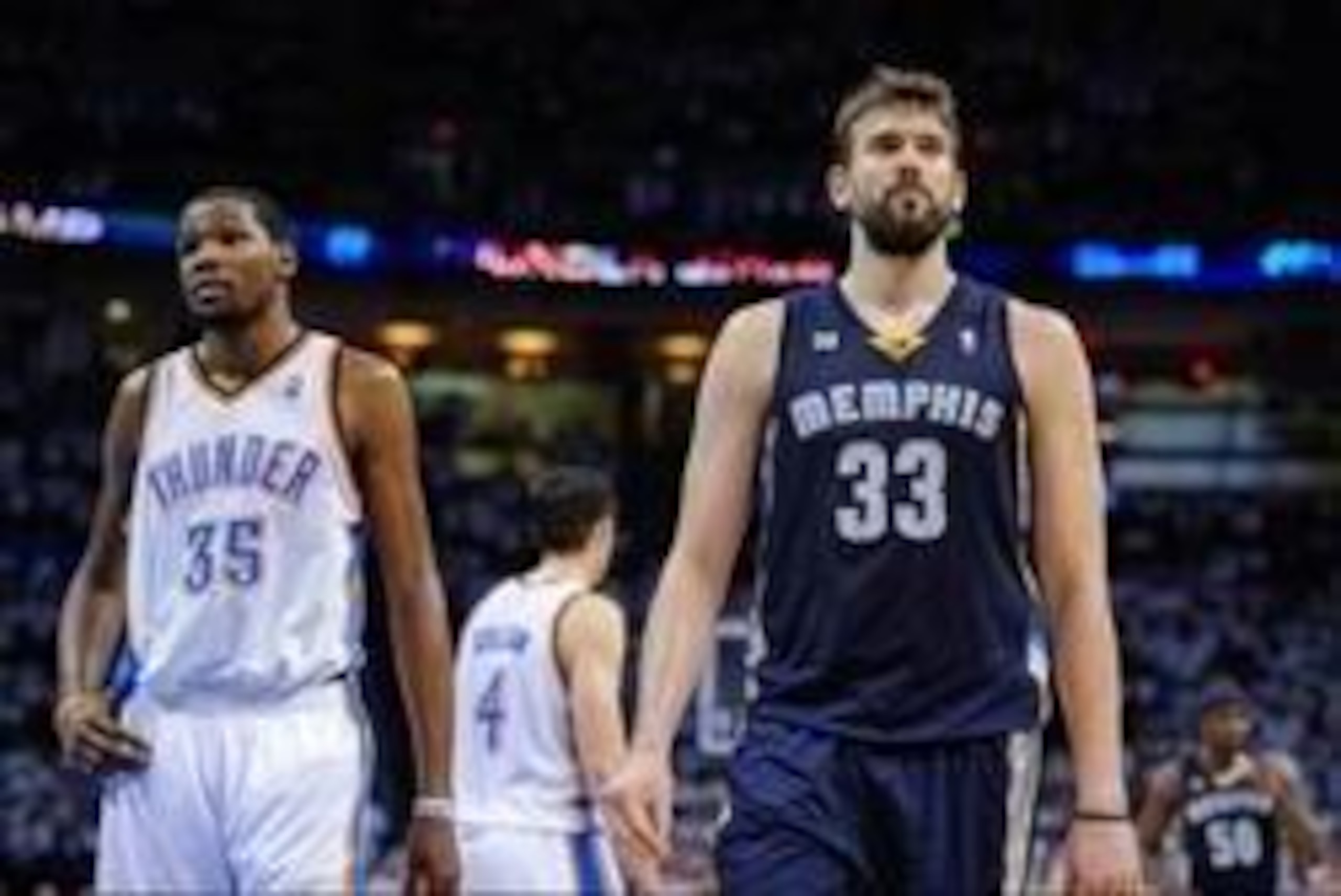 May 15, 2013; Oklahoma City, OK, USA; Memphis Grizzlies center Marc Gasol (33) and Oklahoma City Thunder small forward Kevin Durant (35) wait for play to resume during game five in the second round of the 2013 NBA Playoffs at Chesapeake Energy Arena. The 