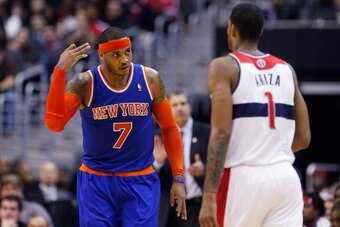 WASHINGTON, DC - MARCH 01: Carmelo Anthony #7 of the New York Knicks celebrates in front of Trevor Ariza #1 of the Washington Wizards after hitting a three point basket during the second half of the Knicks 96-88 win at Verizon Center on March 1, 2013 in W