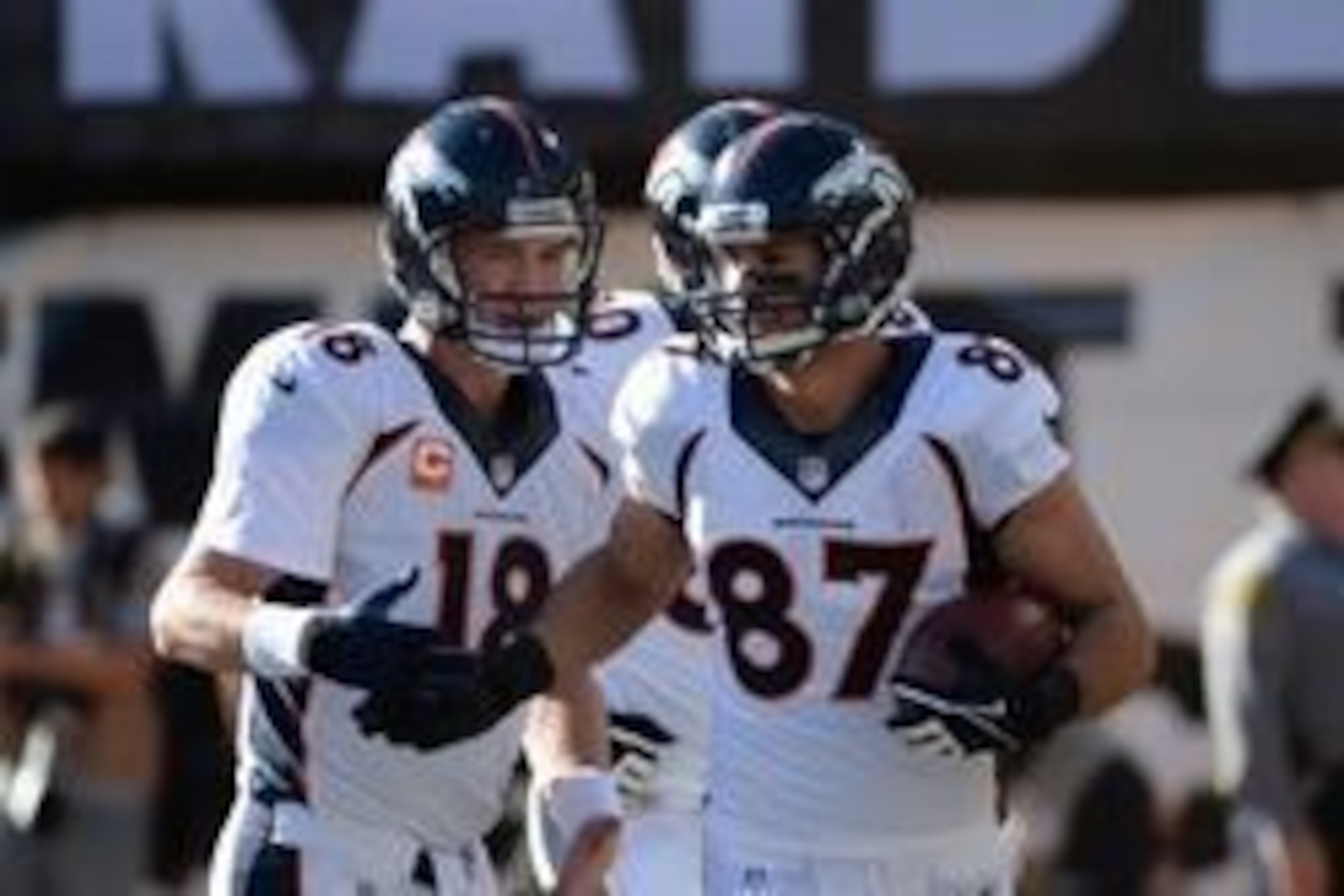 December 29, 2013; Oakland, CA, USA; Denver Broncos quarterback Peyton Manning (18) congratulates wide receiver Eric Decker (87) on a touchdown during the first quarter against the Oakland Raiders at O.co Coliseum. Mandatory Credit: Kyle Terada-USA TODAY 