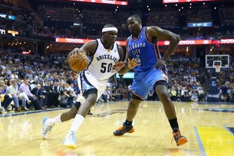MEMPHIS, TN - APRIL 24: Zach Randolph #50 of the Memphis Grizzlies dribbles the ball while defended by Kendrick Perkins #5 of the Oklahoma City Thunder during  Game 3 of the Western Conference Quarterfinals during the 2014 NBA Playoffs at FedExForum on Ap