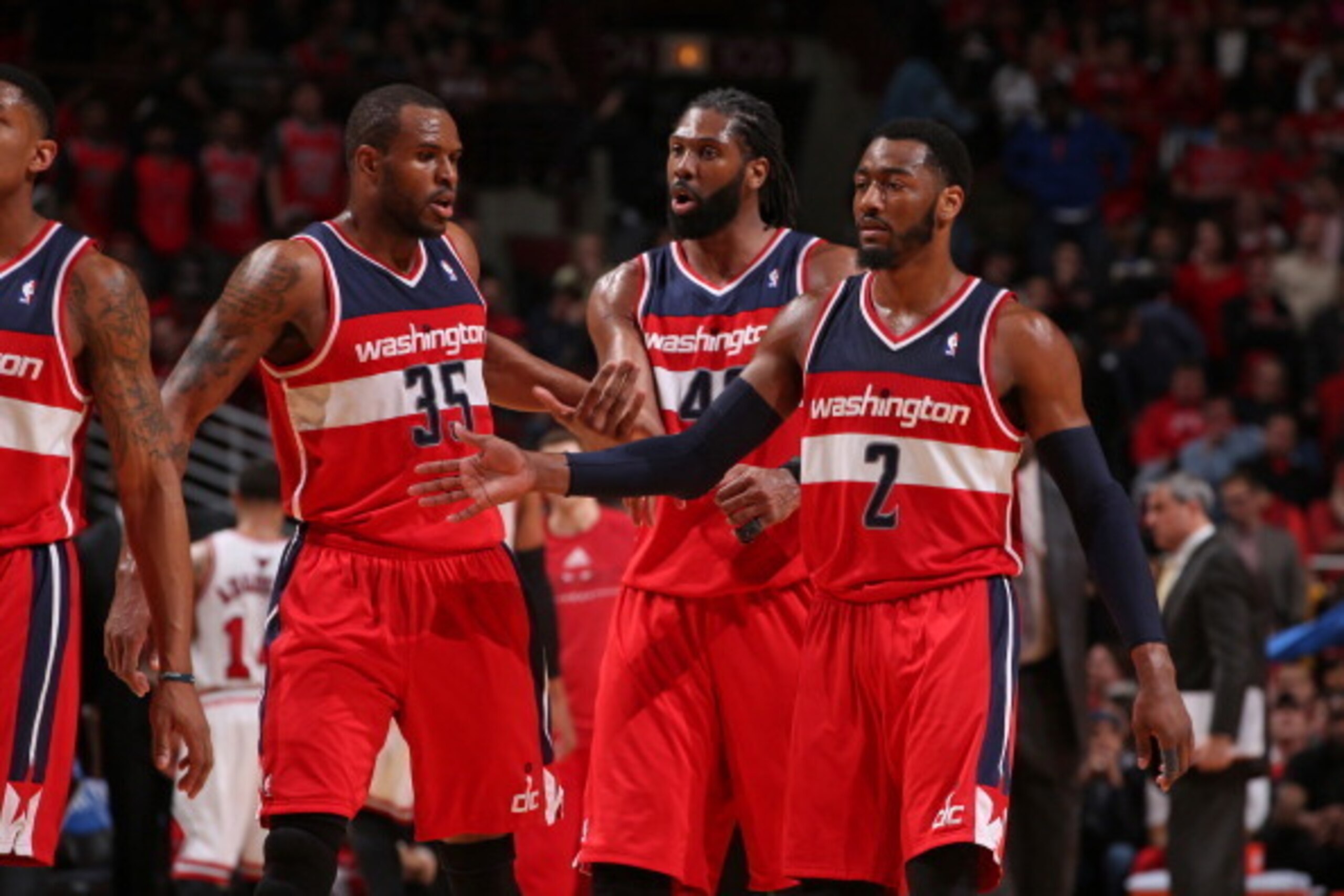CHICAGO, IL - APRIL 22:  Trevor Booker #35, Nene Hilario #42 and John Wall #2 of the Washington Wizards walk off the court in Game 2 of the Eastern Conference Quarterfinals against the Chicago Bulls on April 22, 2014 at the United Center in Chicago, Illin