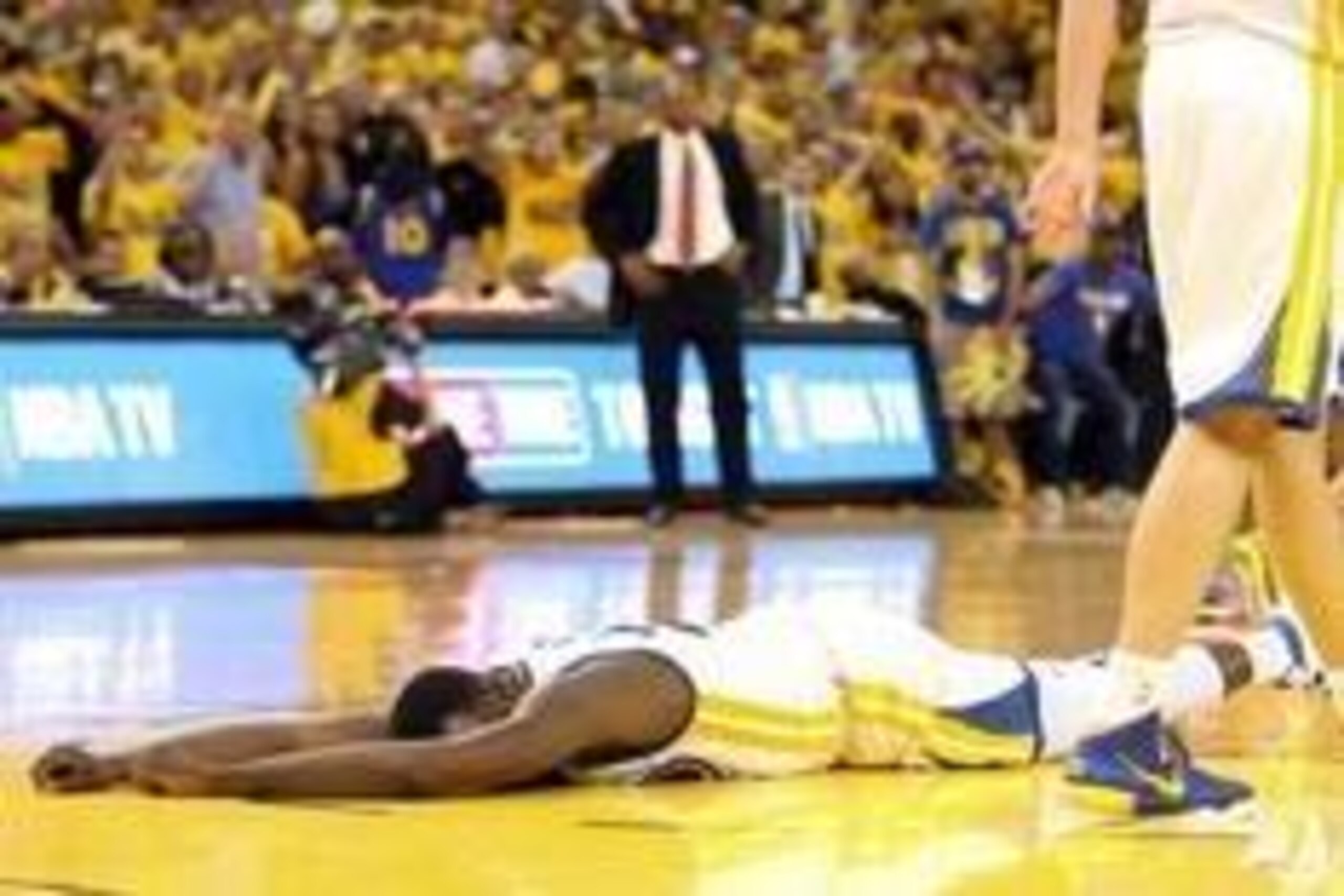 Apr 24, 2014; Oakland, CA, USA; Golden State Warriors forward Draymond Green (23) lays on the court after his sixth foul against the Los Angeles Clippers during the fourth quarter of game three of the first round of the 2014 NBA Playoffs at Oracle Arena. 