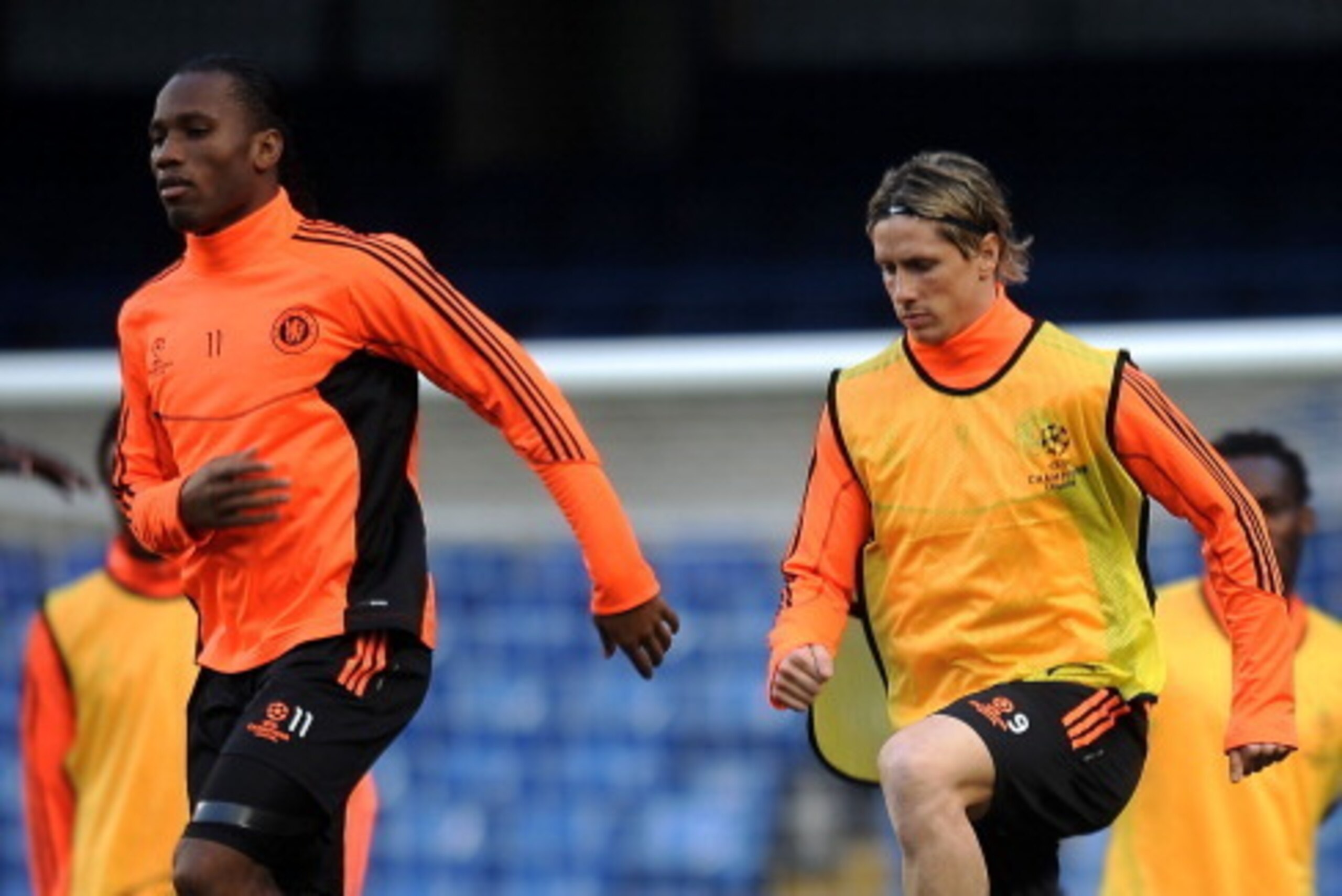 LONDON, ENGLAND - MARCH 13:  Didier Drogba and Fernando Torres warm up during a training session ahead of the UEFA Champions League round of sixteen, second leg match between Chelsea FC and Napoli at Stamford Bridge on March 13, 2012 in London, England.
