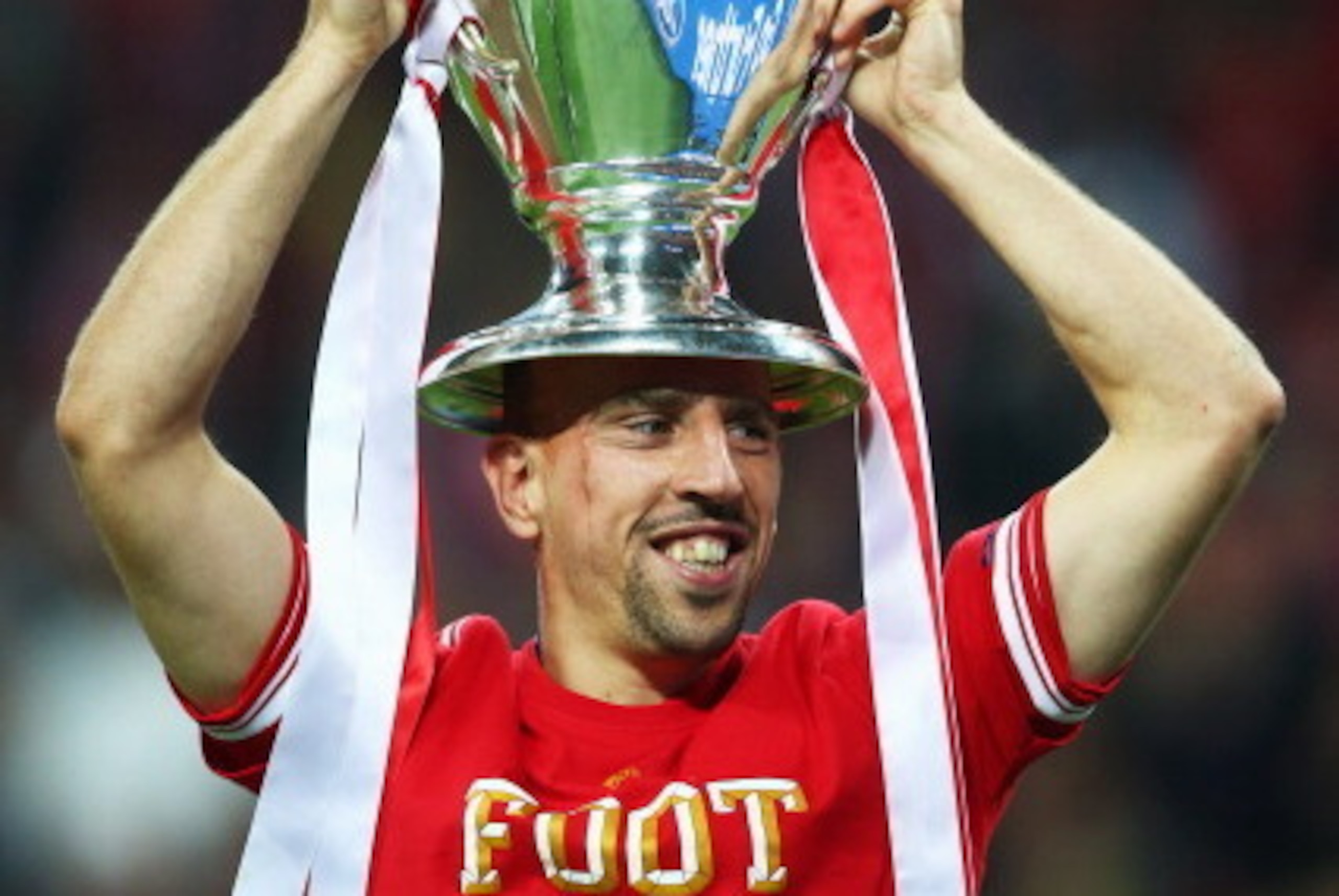 LONDON, ENGLAND - MAY 25:  Franck Ribery of Bayern Muenchen celebrates with the trophy after victory in the UEFA Champions League final match between Borussia Dortmund and FC Bayern Muenchen at Wembley Stadium on May 25, 2013 in London, United Kingdom.  (