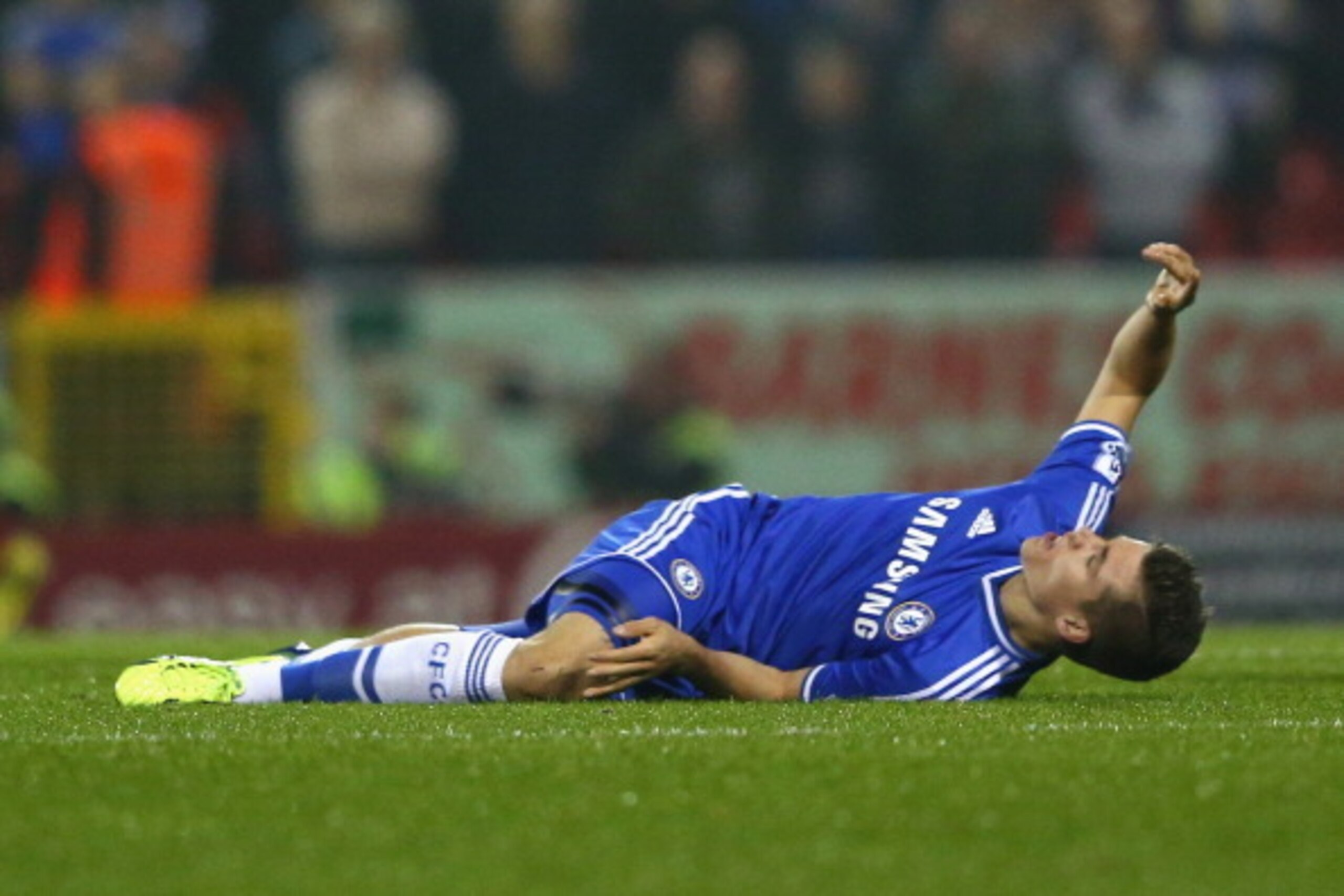 SWINDON, ENGLAND - SEPTEMBER 24:  Marco van Ginkel of Chelsea lies in pain after a challenge lead the midfielder to suffer a torn anterior cruciate ligament during the Capital One Cup third round match between Swindon Town and Chelsea at the County Ground
