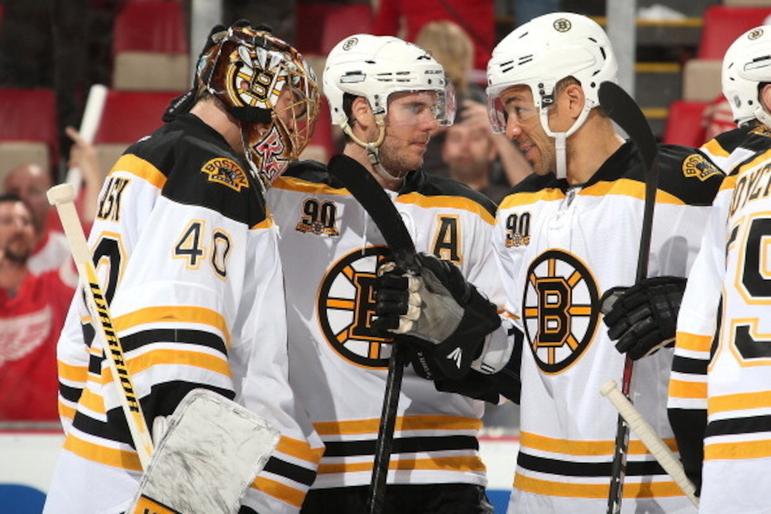 DETROIT, MI - APRIL 22:  Jarome Iginla #12 and David Krejci #46 congratulate teammate Tuukka Rask #40 on his shutout win after Game Three of the First Round of the 2014 Stanley Cup Playoffs against the Detroit Red Wings on April 22, 2014 at Joe Louis Aren