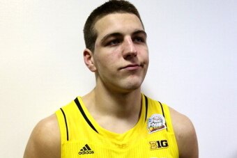ATLANTA, GA - APRIL 08:  Mitch McGary #4 of the Michigan Wolverines stands dejected in the locker room after Michigan lost 82-76 against the Louisville Cardinals during the 2013 NCAA Men's Final Four Championship at the Georgia Dome on April 8, 2013 in At