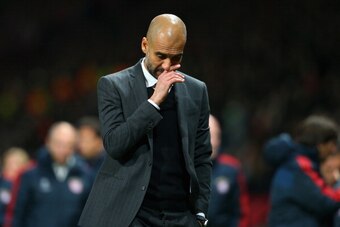 MANCHESTER, ENGLAND - APRIL 01:  Pep Guardiola head coach of Bayern Muenchen reacts at the end of match during the UEFA Champions League Quarter Final first leg match between Manchester United and FC Bayern Muenchen at Old Trafford on April 1, 2014 in Man