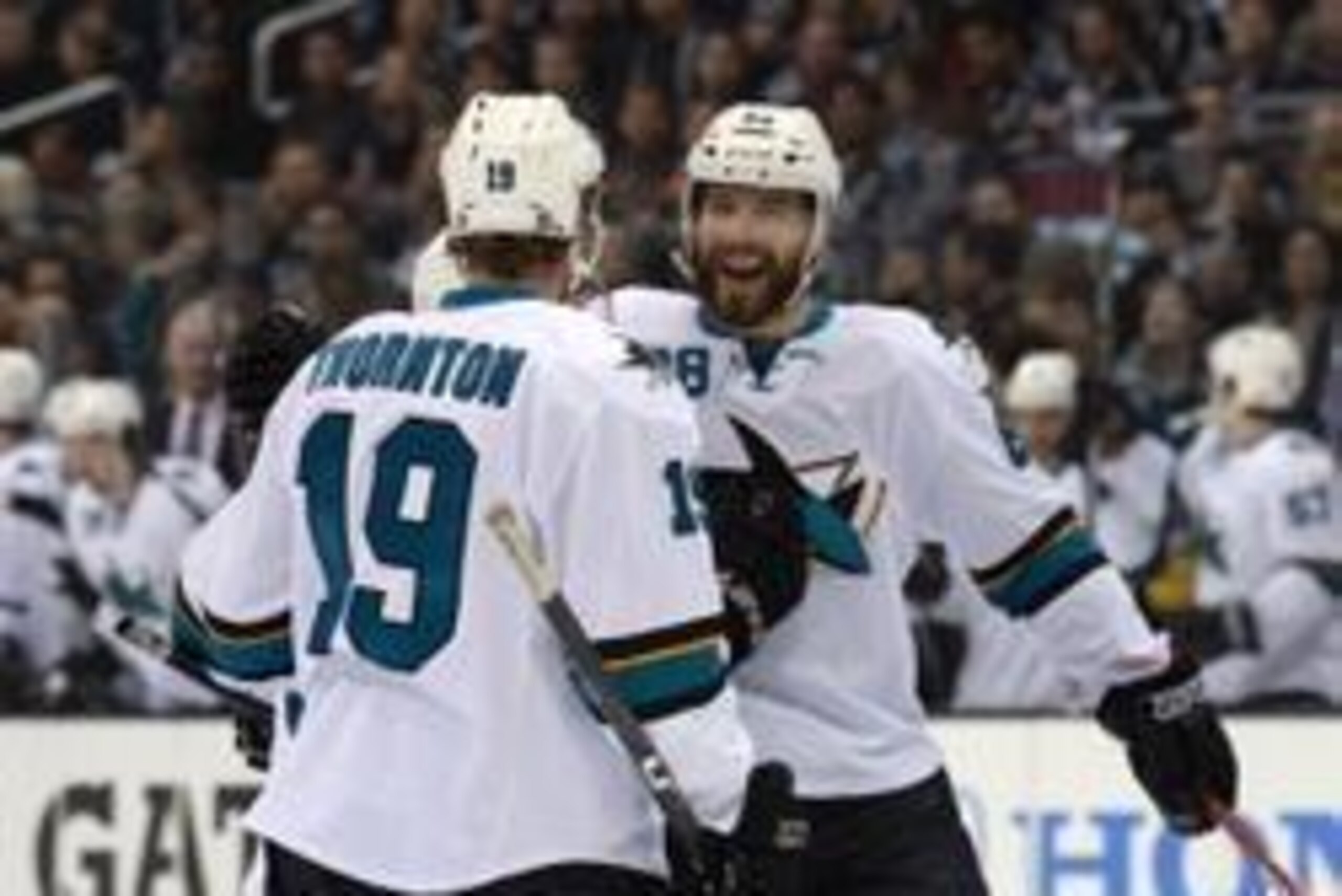 Apr 22, 2014; Los Angeles, CA, USA; San Jose Sharks right wing Brent Burns (88) celebrates with defenseman Dan Boyle (22) and center Joe Thornton (19) after a goal in the first period against the Los Angeles Kings in game three of the first round of the 2 Apr 22, 2014; Los Angeles, CA, USA; San Jose Sharks right wing Brent Burns (88) celebrates with defenseman Dan Boyle (22) and center Joe Thornton (19) after a goal in the first period against the Los Angeles Kings in game three of the first round of the 2