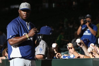 PHOENIX, AZ - APRIL 11:  Yasiel Puig #66 of the Los Angeles Dodgers signs autographs for fans before the MLB game against the Arizona Diamondbacks at Chase Field on April 11, 2014 in Phoenix, Arizona.  (Photo by Christian Petersen/Getty Images)