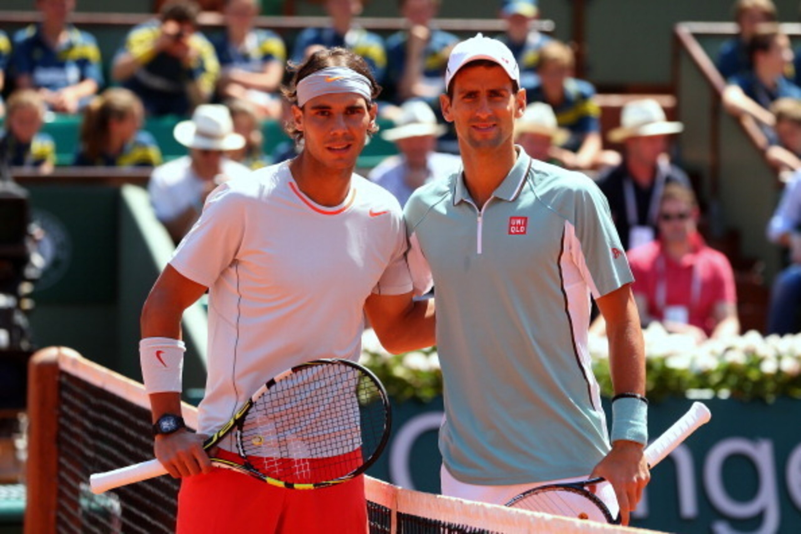PARIS, FRANCE - JUNE 07:  Rafael Nadal of Spain poses at the net with Novak Djokovic of Serbia before their men's singles semi-final match on day thirteen of the French Open at Roland Garros on June 7, 2013 in Paris, France.  (Photo by Julian Finney/Getty