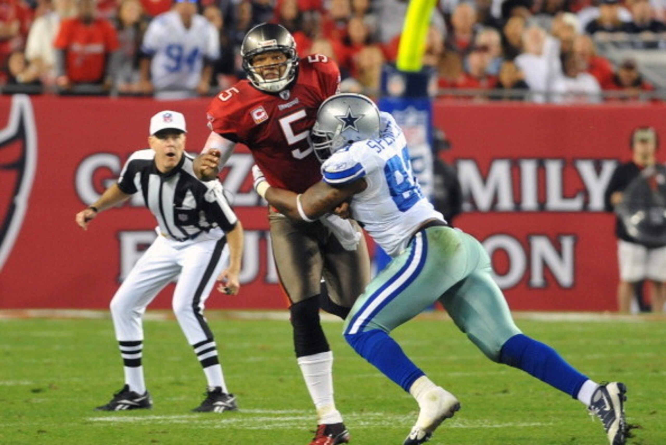 TAMPA, FL - DECEMBER 17:  Linebacker Anthony Spencer #93 of the Dallas Cowboys pressures quarterback Josh Freeman #5 of the Tampa Bay Buccaneers December 17, 2011 at Raymond James Stadium in Tampa, Florida. (Photo by Al Messerschmidt/Getty Images)