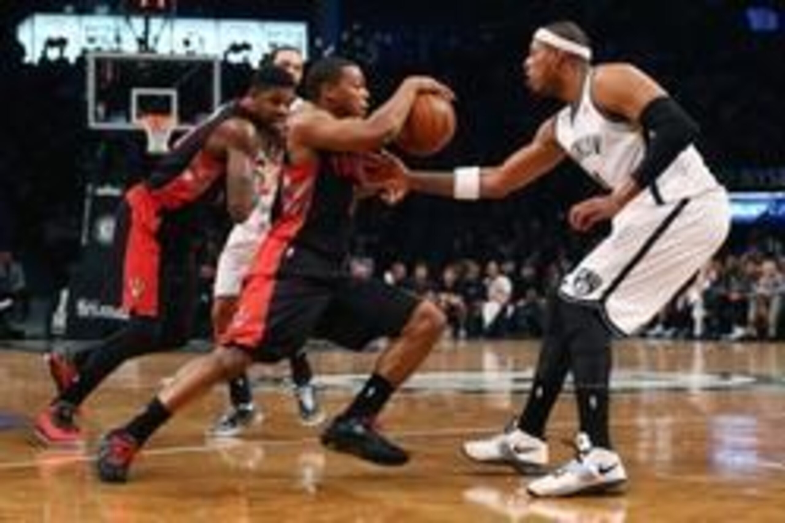 Apr 25, 2014; Brooklyn, NY, USA;  Brooklyn Nets forward Paul Pierce (34) defends Toronto Raptors guard Kyle Lowry (7) during the second quarter in game three of the first round of the 2014 NBA Playoffs at Barclays Center. Mandatory Credit: Anthony Gruppus