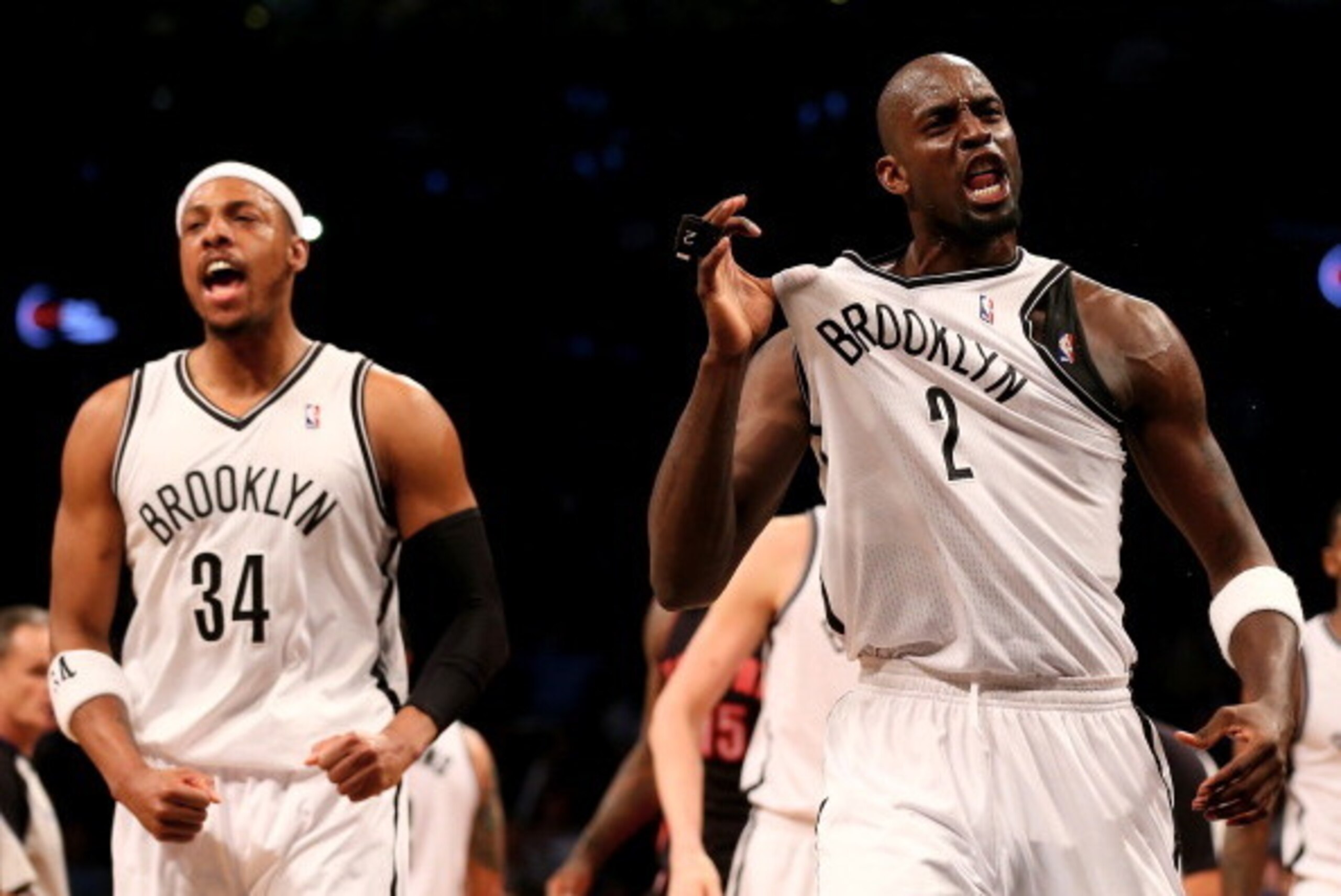 NEW YORK, NY - APRIL 25:  Kevin Garnett #2 of the Brooklyn Nets celebrates with teammate Paul Pierce #34 in the second quarter against the Toronto Raptors in Game Three of the Eastern Conference Quarterfinals during the 2014 NBA Playoffs at the Barclays C