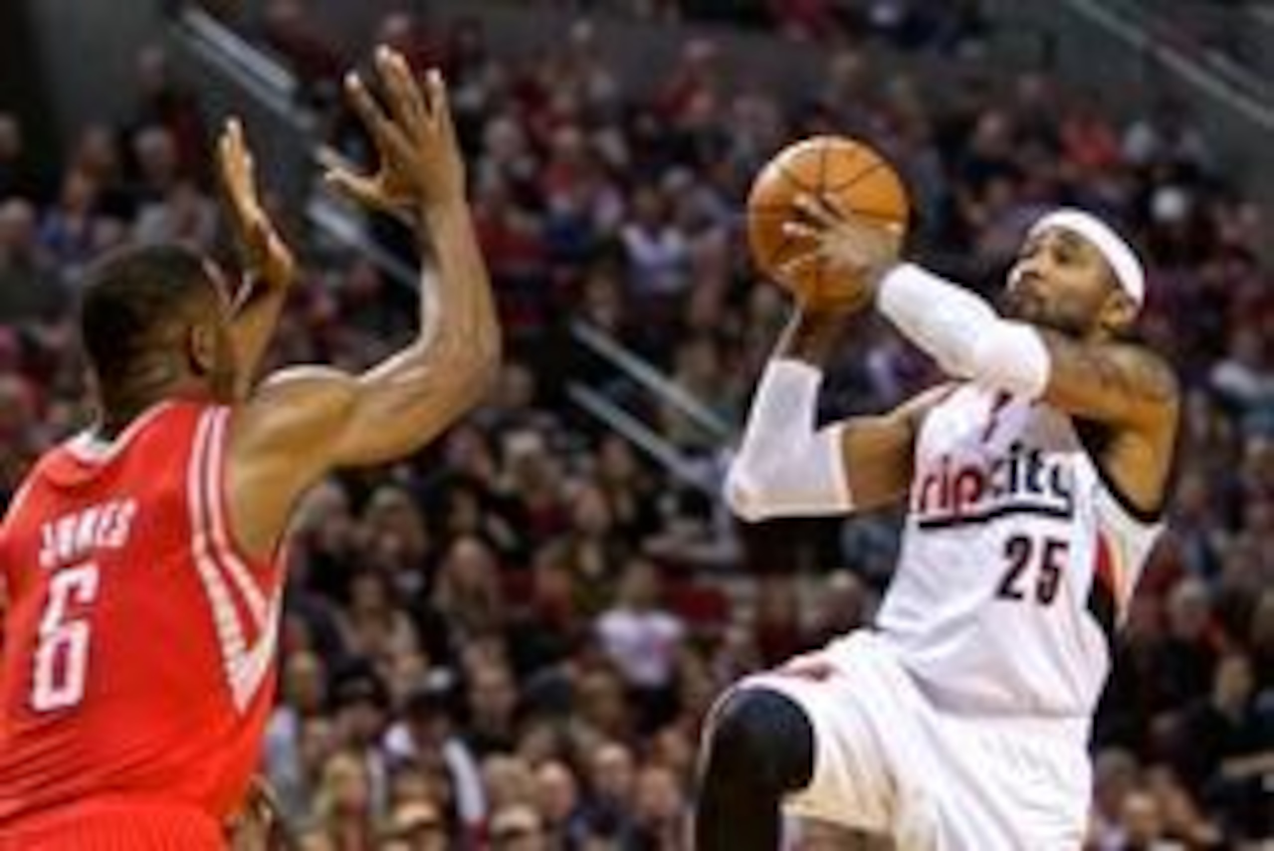 Apr 25, 2014; Portland, OR, USA; Portland Trail Blazers guard Mo Williams (25) shoots over Houston Rockets forward Terrence Jones (6) during the second quarter in game three of the first round of the 2014 NBA Playoffs at the Moda Center. Mandatory Credit: