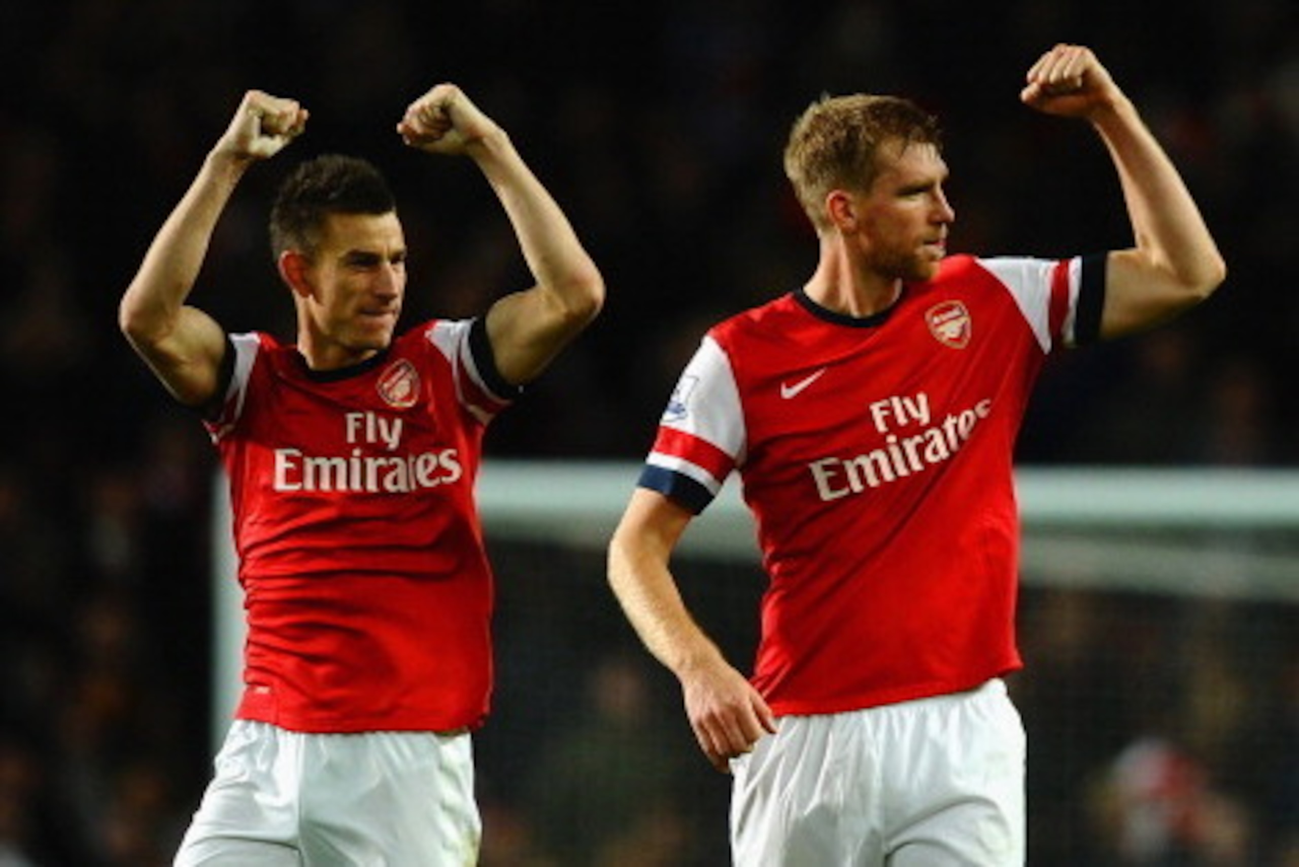 LONDON, ENGLAND - NOVEMBER 02:  Laurent Koscielny of Arsenal and Per Mertesacker of Arsenal celebrate victory at the final whistle during the Barclays Premier League match between Arsenal and Liverpool at Emirates Stadium on November 2, 2013 in London, En
