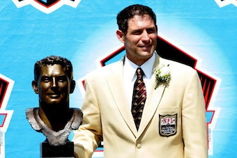 CANTON, OH - AUGUST 7: Pro Football Hall of Fame enshrinee Steve Young of the San Francisco 49ers poses with his bust during the 2005 NFL Hall of Fame enshrinement ceremony on August 7, 2005 in Canton, Ohio. (Photo by Jonathan Daniel/Getty Images)