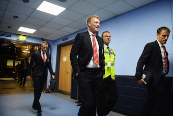 MANCHESTER, ENGLAND - SEPTEMBER 22:  (L-R) Tom Cleverley, David Moyes manager of Manchester United and coach Phil Neville arrive at the stadium before the Barclays Premier League match between Manchester City and Manchester United at the Etihad Stadium on