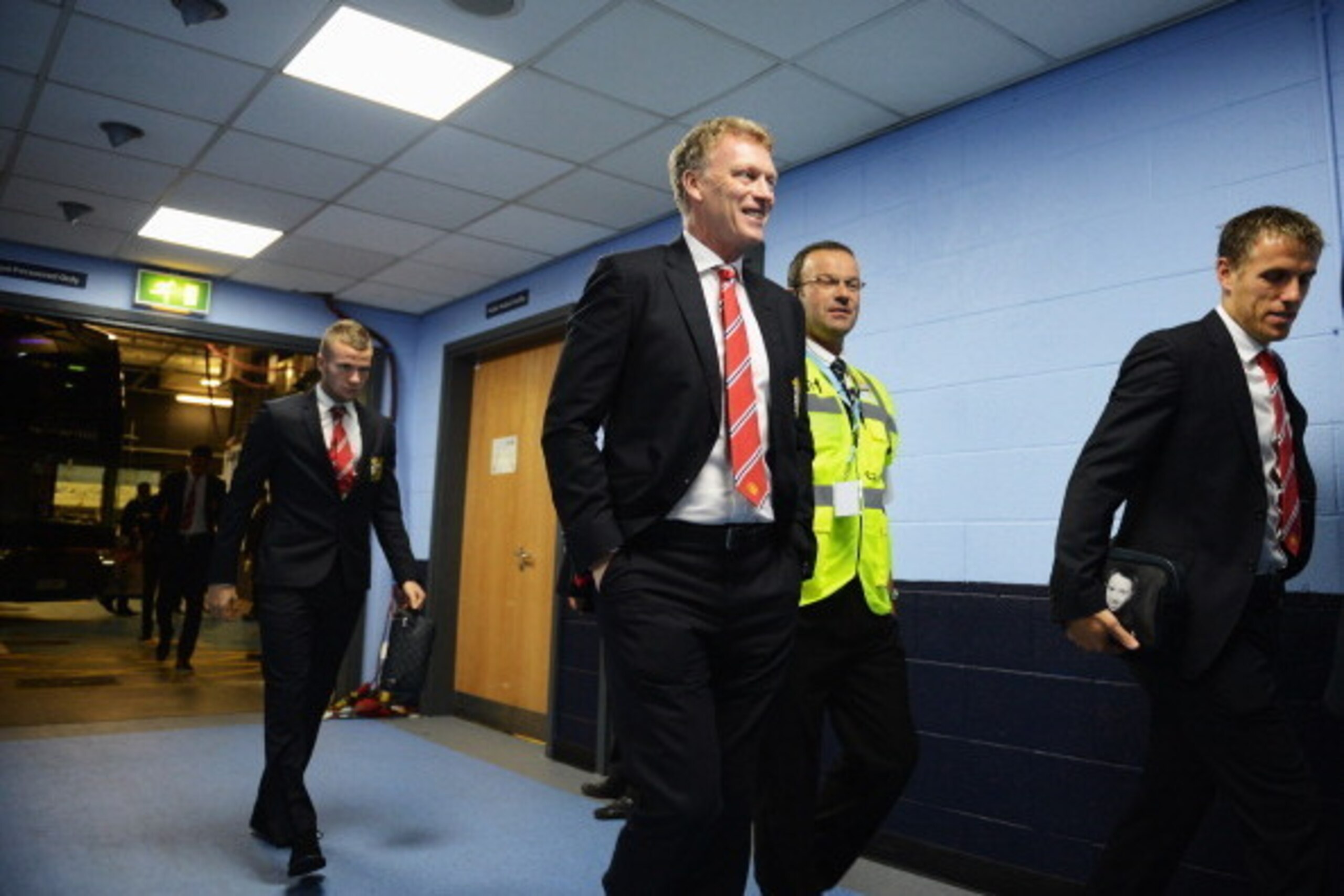 MANCHESTER, ENGLAND - SEPTEMBER 22:  (L-R) Tom Cleverley, David Moyes manager of Manchester United and coach Phil Neville arrive at the stadium before the Barclays Premier League match between Manchester City and Manchester United at the Etihad Stadium on