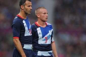 MANCHESTER, ENGLAND - JULY 26: Ryan Giggs of Great Britain looks on with Tom Cleverley during the Men's Football first round Group A Match of the London 2012 Olympic Games between Great Britain and Senegal, at Old Trafford on July 26, 2012 in Manchester,