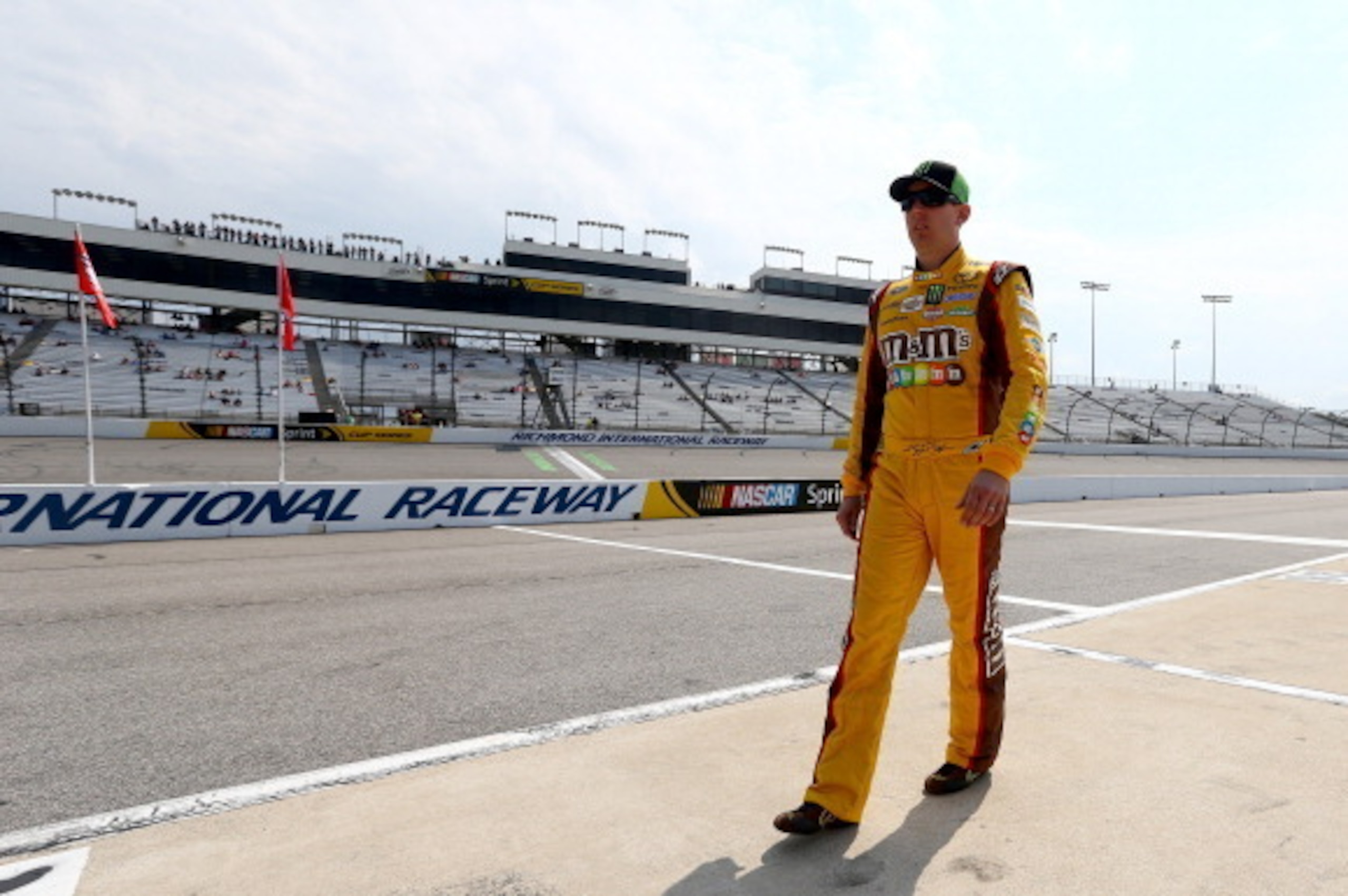 RICHMOND, VA - APRIL 25: Kyle Busch, driver of the #54 Monster Energy Toyota, walks on the grid during qualifying for the NASCAR Nationwide Series ToyotaCare 250 at Richmond International Raceway on April 25, 2014 in Richmond, Virginia. Busch wore his Spr RICHMOND, VA - APRIL 25: Kyle Busch, driver of the #54 Monster Energy Toyota, walks on the grid during qualifying for the NASCAR Nationwide Series ToyotaCare 250 at Richmond International Raceway on April 25, 2014 in Richmond, Virginia. Busch wore his Spr
