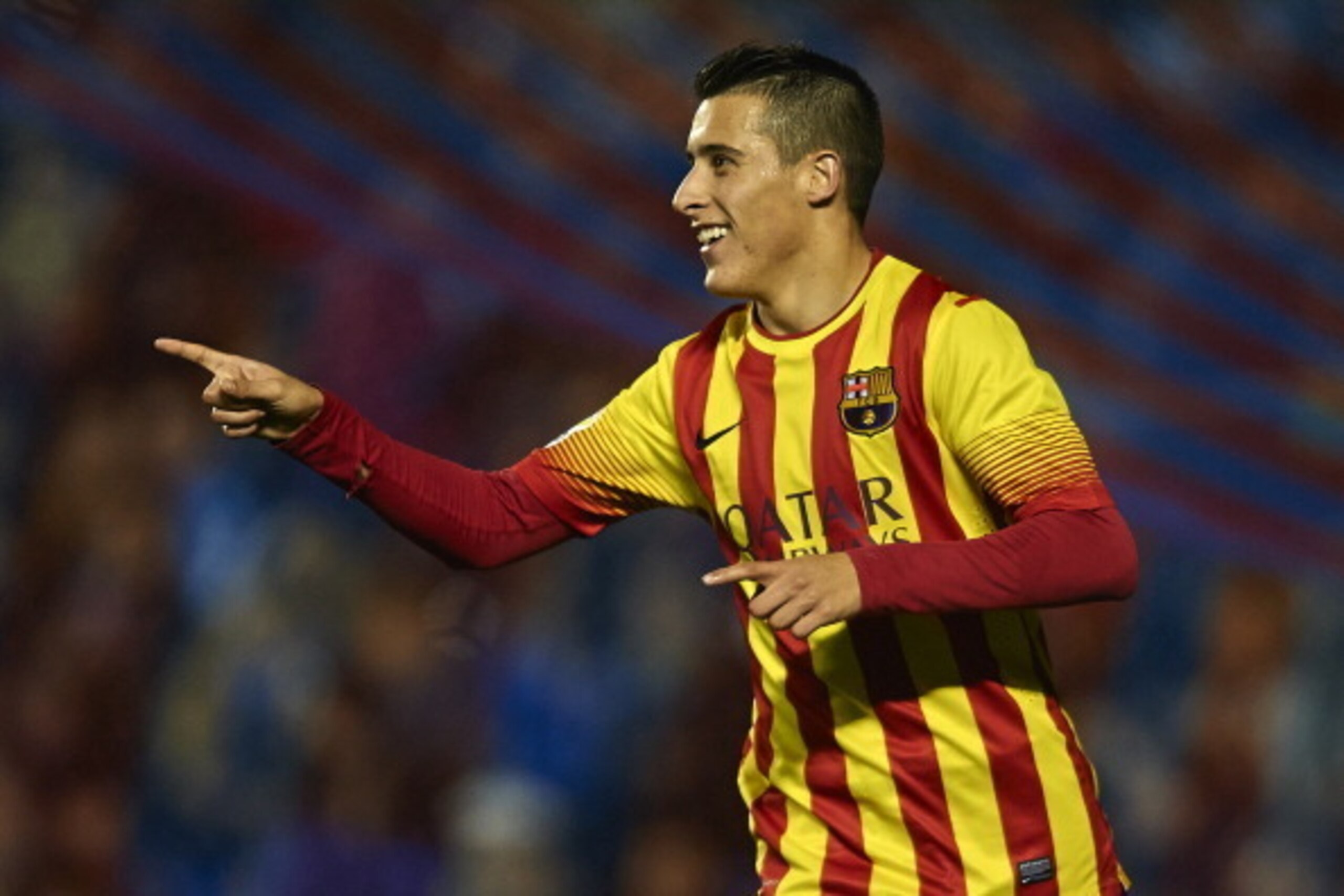 VALENCIA, SPAIN - JANUARY 22:  Cristian Tello of Barcelona celebrates after scoring during the Copa del Rey Quarter Final First Leg match between Levante UD and FC Barcelona at Ciutat de Valencia on January 22, 2014 in Valencia, Spain.  (Photo by Manuel Q