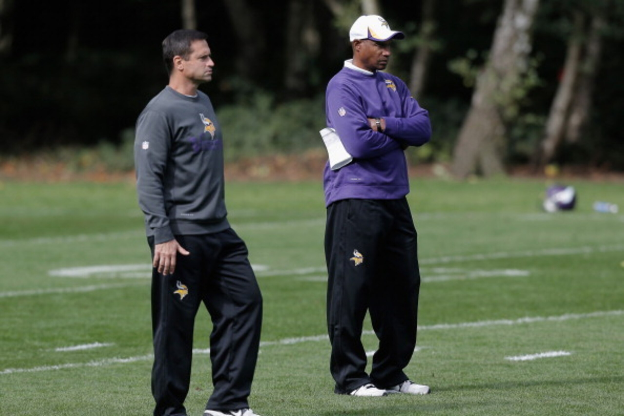 LONDON, ENGLAND - SEPTEMBER 26:  Special Teams Coordinator Mike Priefer (L) and Head Coach Leslie Frazier look on during a Minnesota Vikings training session at the Grove Hotel on September 26, 2013 in London, England.  (Photo by Harry Engels/Getty Images