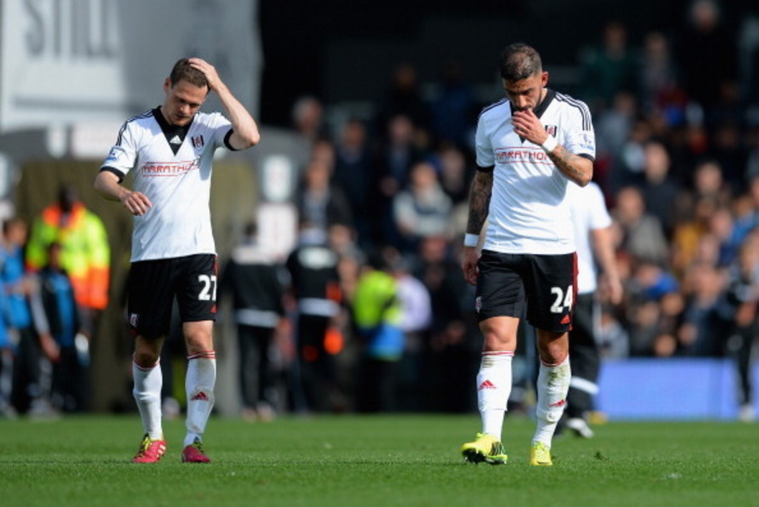 LONDON, ENGLAND - APRIL 26:  Sasha Riether and Ashkan Dejagah of Fulham look dejected at the end of the match during the Barclays Premier League match bewteen Fulham and Hull City at Craven Cottage on April 26, 2014 in London, England.  (Photo by Christop
