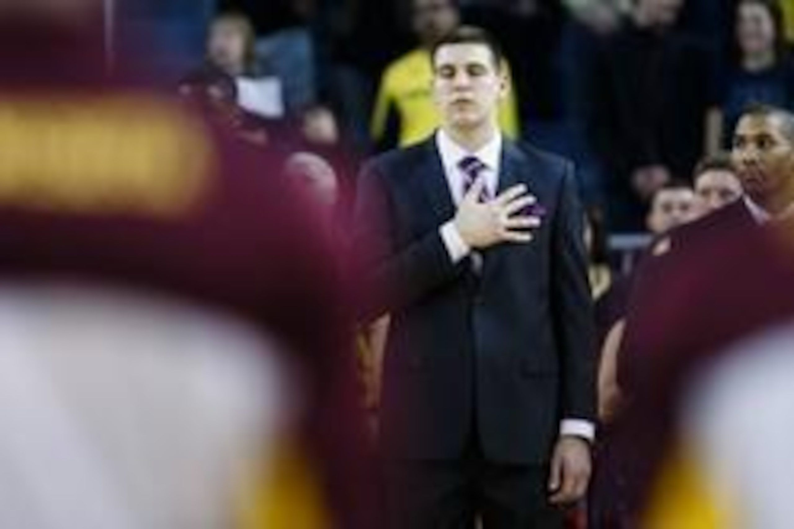 Mar 1, 2014; Ann Arbor, MI, USA; Michigan Wolverines forward Mitch McGary (4) during the national anthem before the game against the Minnesota Golden Gophers at Crisler Arena. Mandatory Credit: Rick Osentoski-USA TODAY Sports